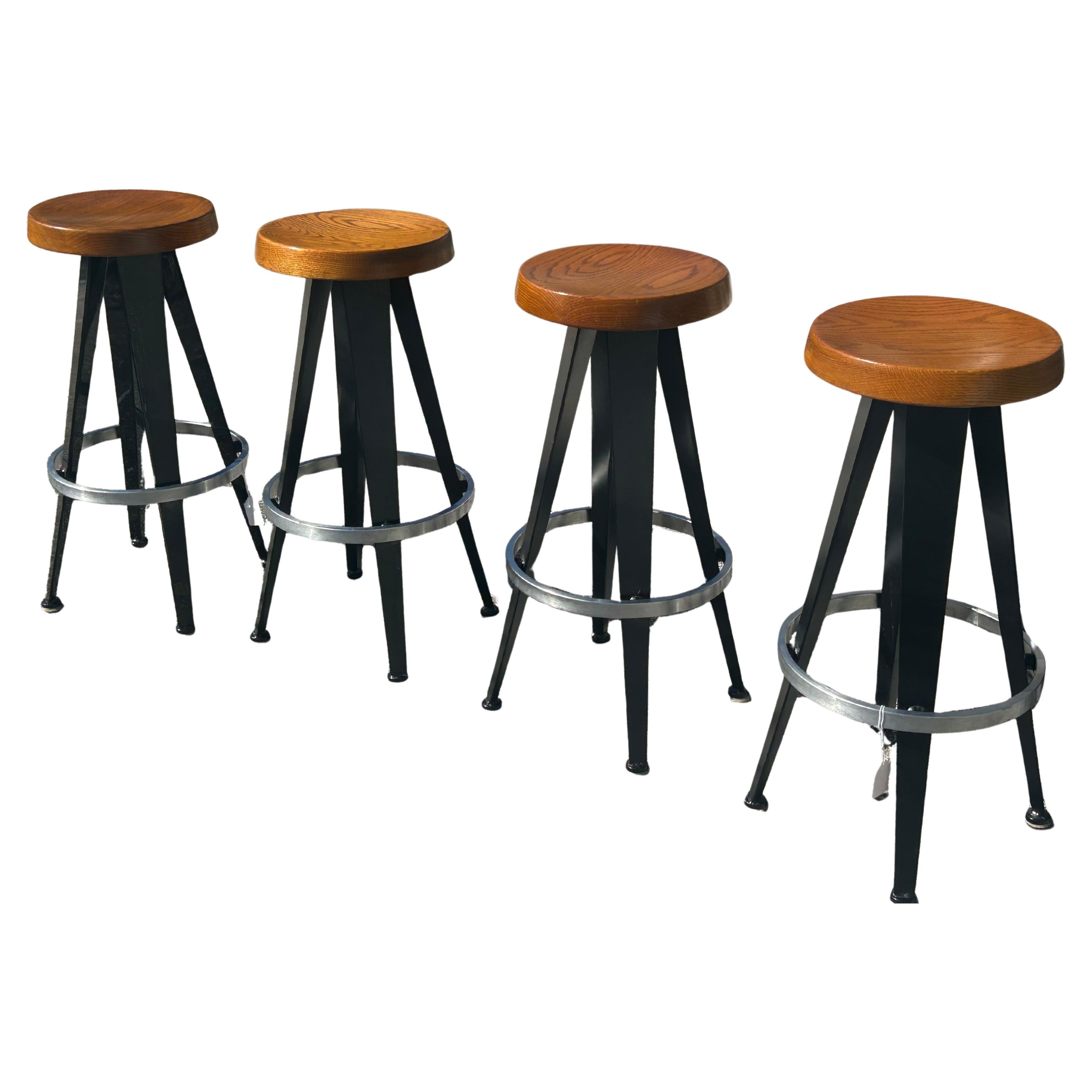 Jean Prouve after. Four modernist barstools.