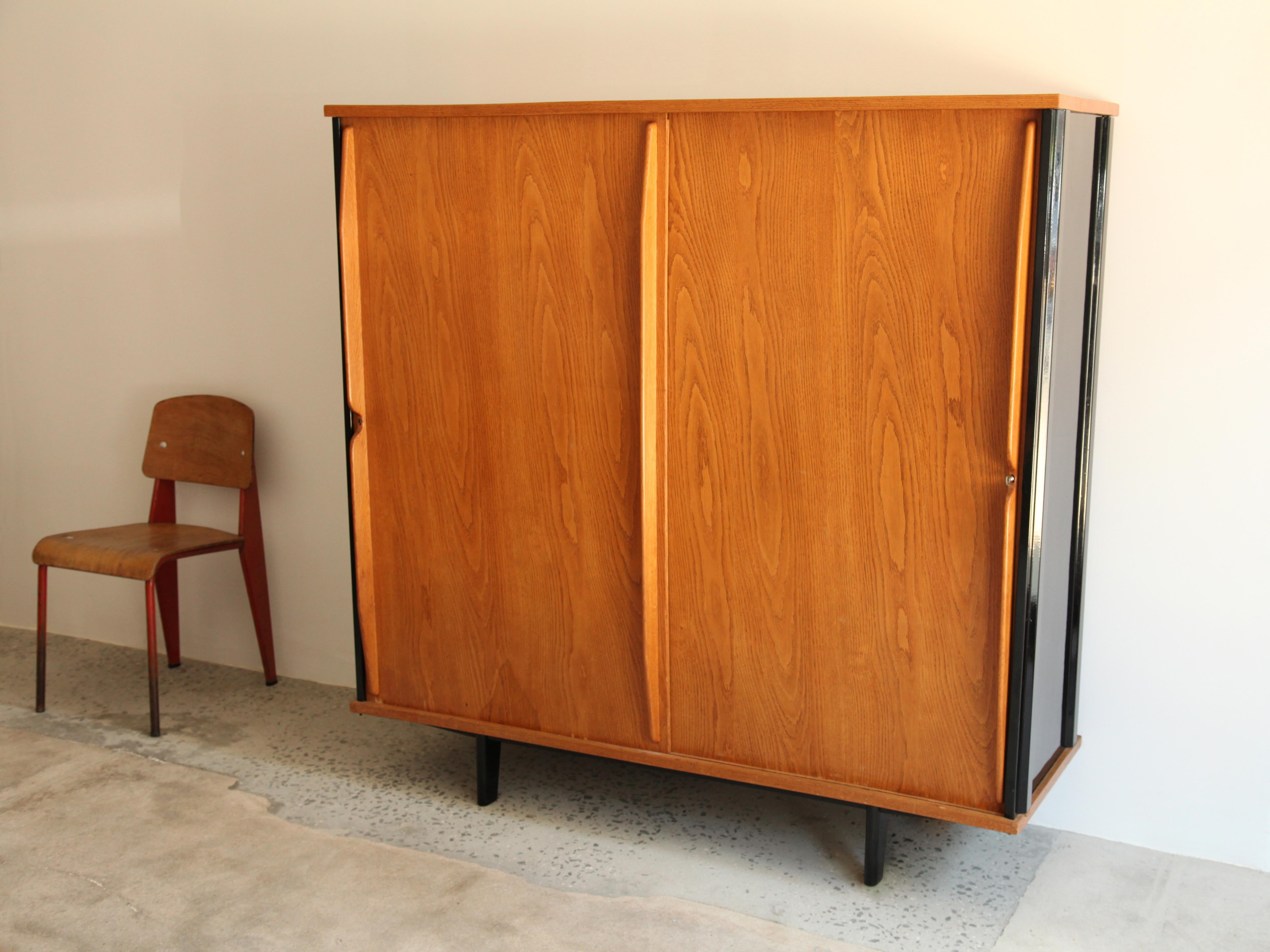 Cabinet model AG11 variant with lock by Jean Prouve and executed by Ateliers Jean Prouvé, circa 1947. Black lacquered steel, solid oak and oak plywood.