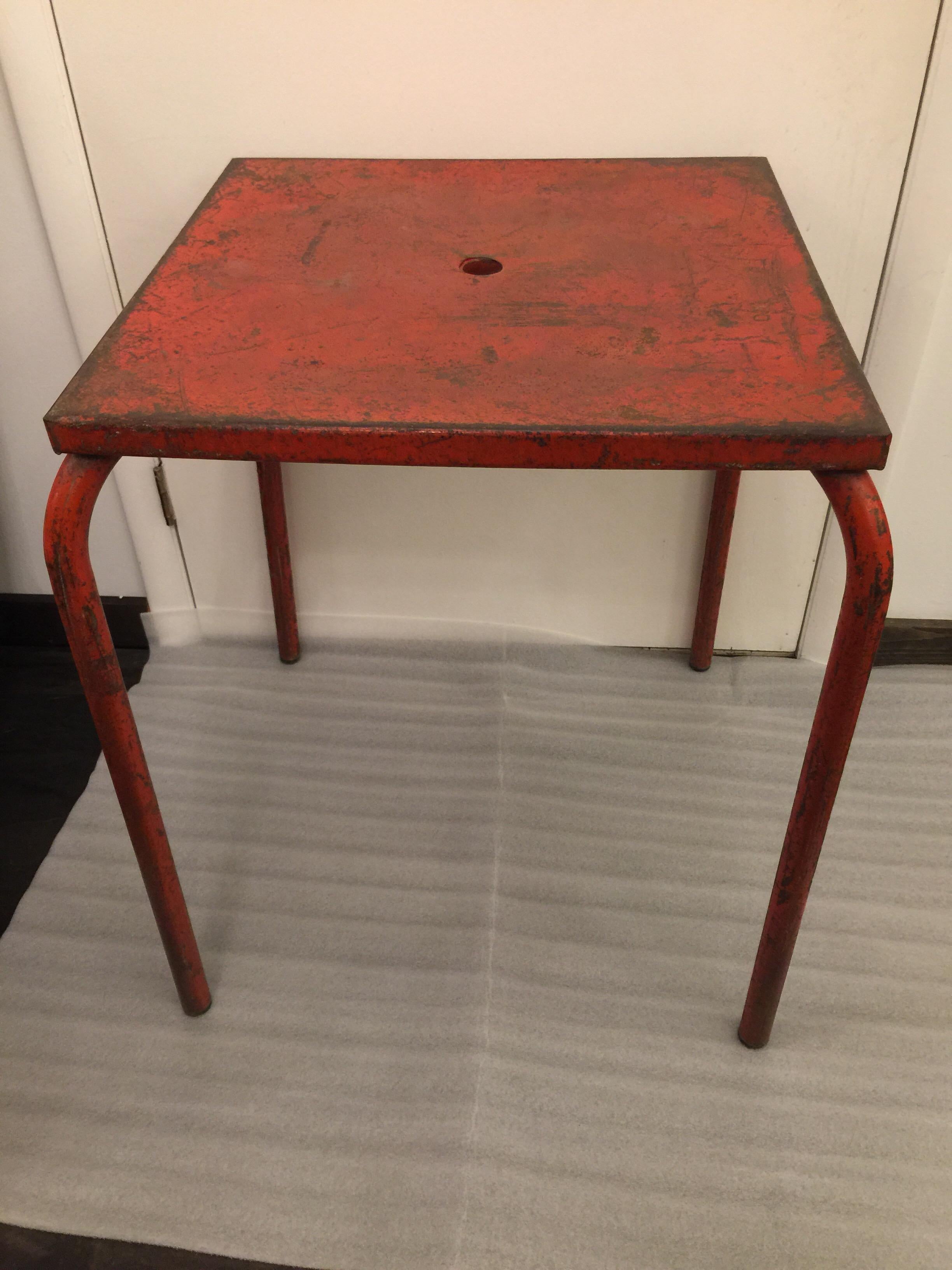 Beautifully distressed through the years of being outside and earning a rich patina. This Jean Prouvé attributed table has a deep classic red paint which is classic Prouvé. This table will make a great side table or game table - just stunning!

 