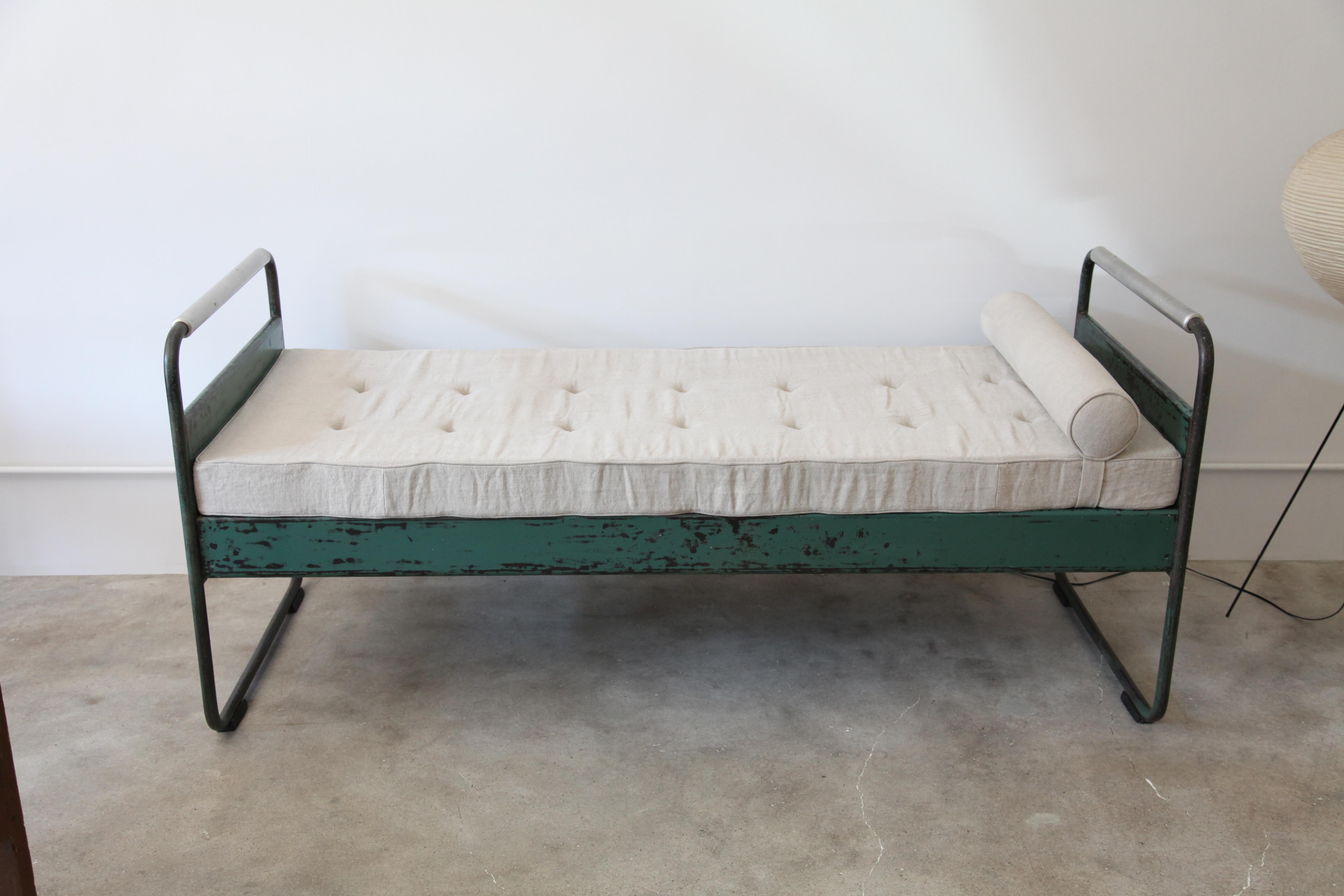 A great early Jean Prouvé bed, circa1935 from the Lycée Fabert, Metz. 

Original paint. Cushion is a newer replacement.