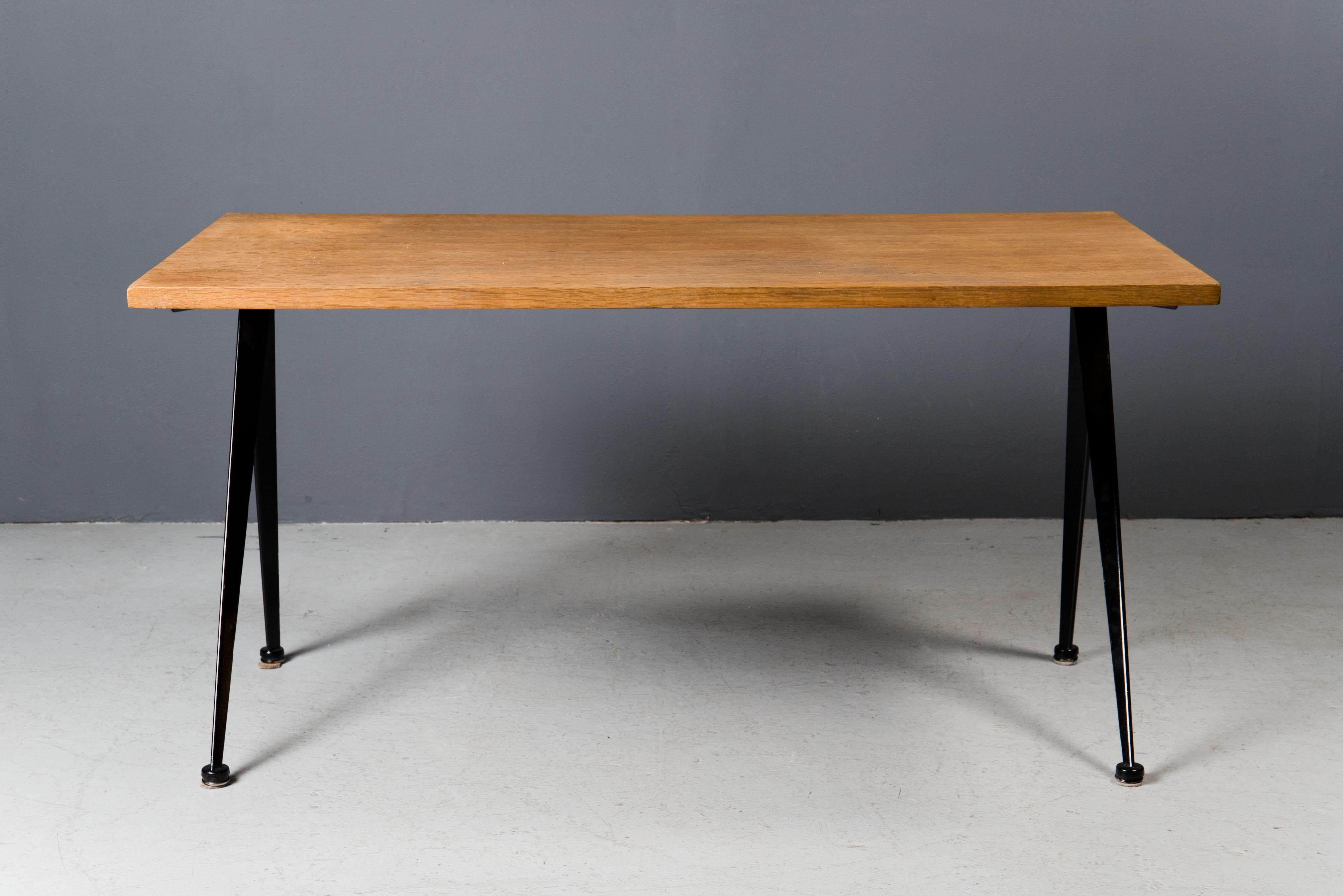 Elegant desk by Jean Prouvé in black color. Produced by Atelier Jean Prouvé in 1950s. Original Oak top.