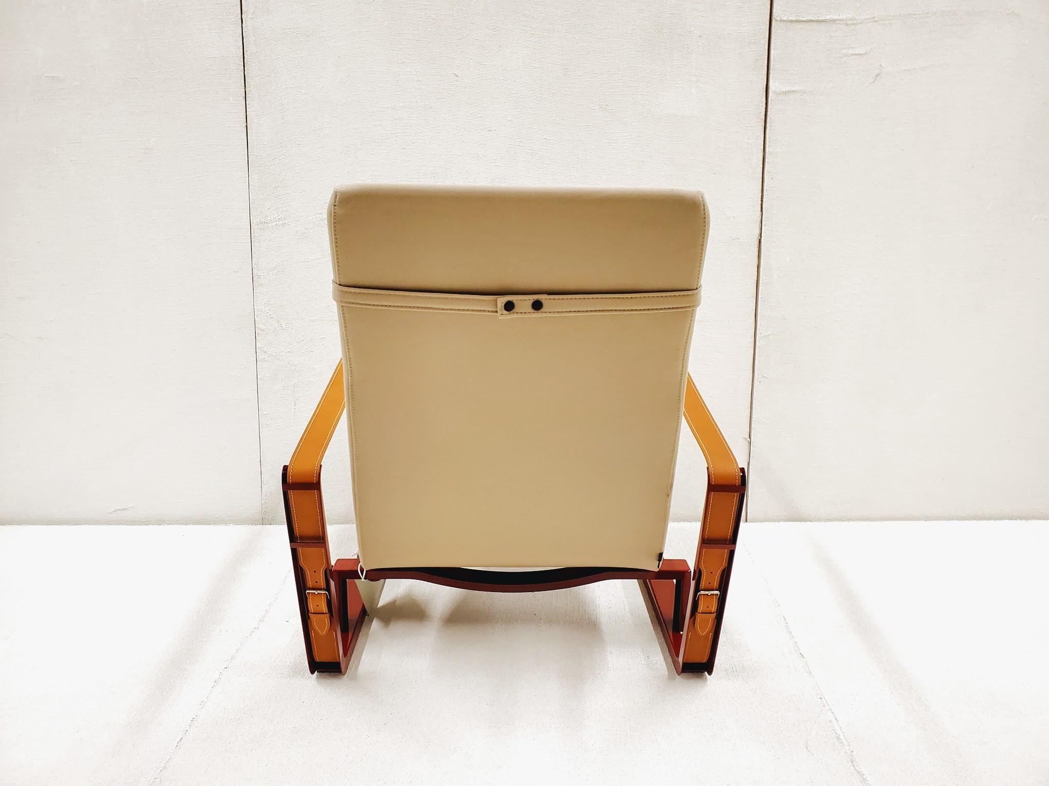 Jean Prouve Cité Armchair - Beige upholstery Japanese Red Base In Excellent Condition In Vancouver, BC