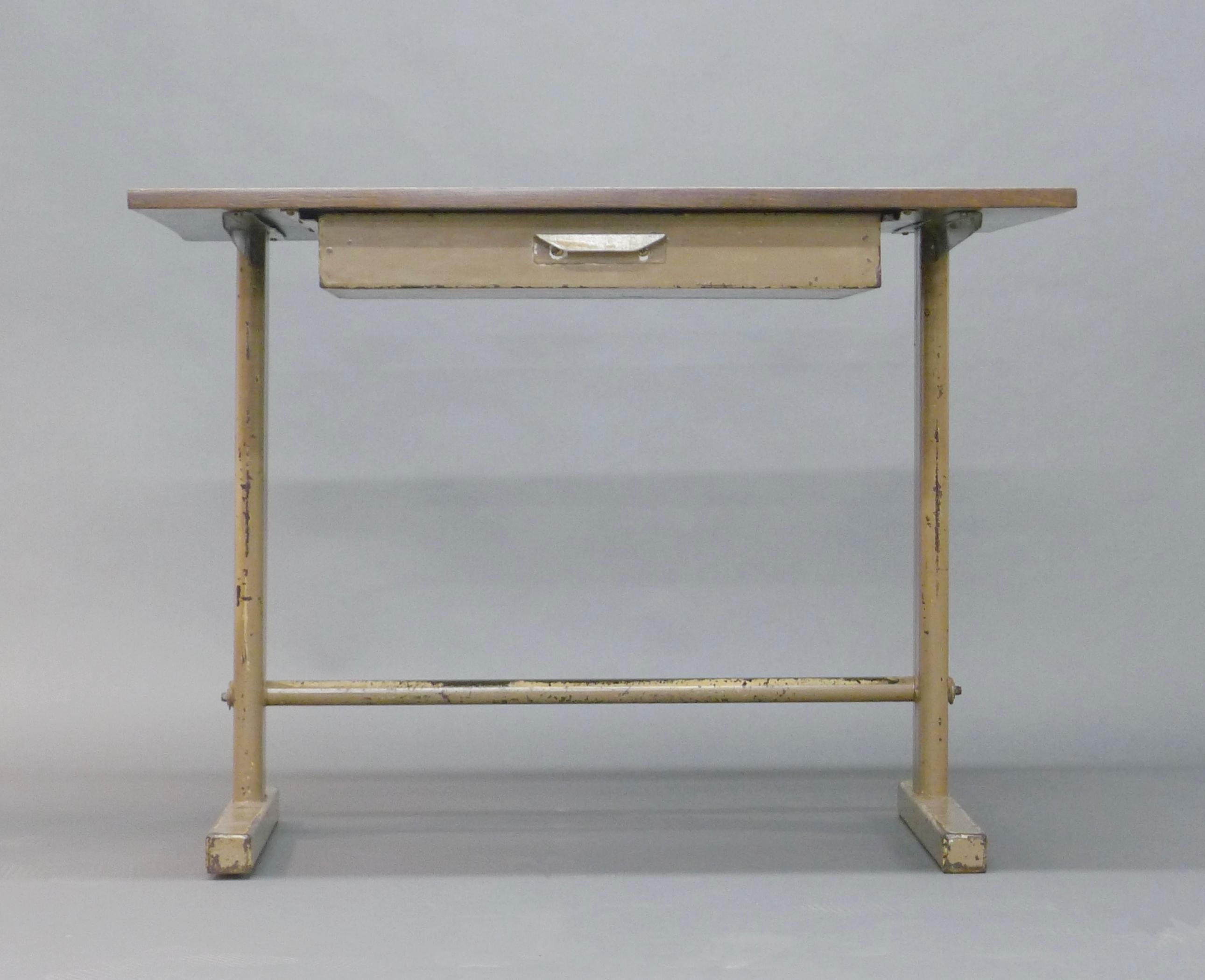 Cité desk with drawer, designed by Jean Prouvé and made in his workshop, Ateliers Jean Prouvé in Nancy, France, probably 1940s

Totally original with cream enamel painted metal frame and oak top, fitted a single drawer to front.

74cm high, 100cm
