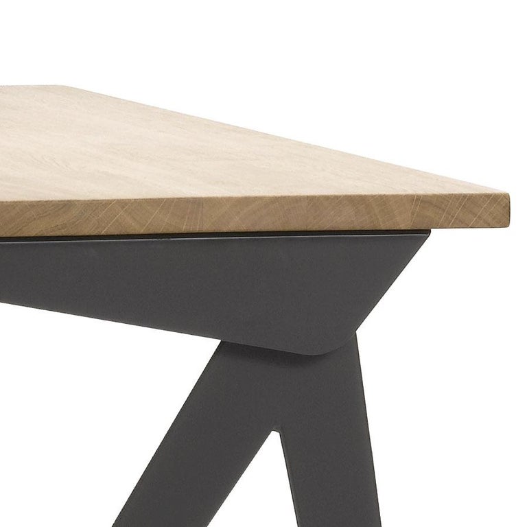 Jean Prouvé compas direction desk in natural oak and black metal for Vitra. Originally designed in 1953, Prouvé's iconic desk is based the design on the structural principles for which he is known. Common to all of them are the slender, elegantly