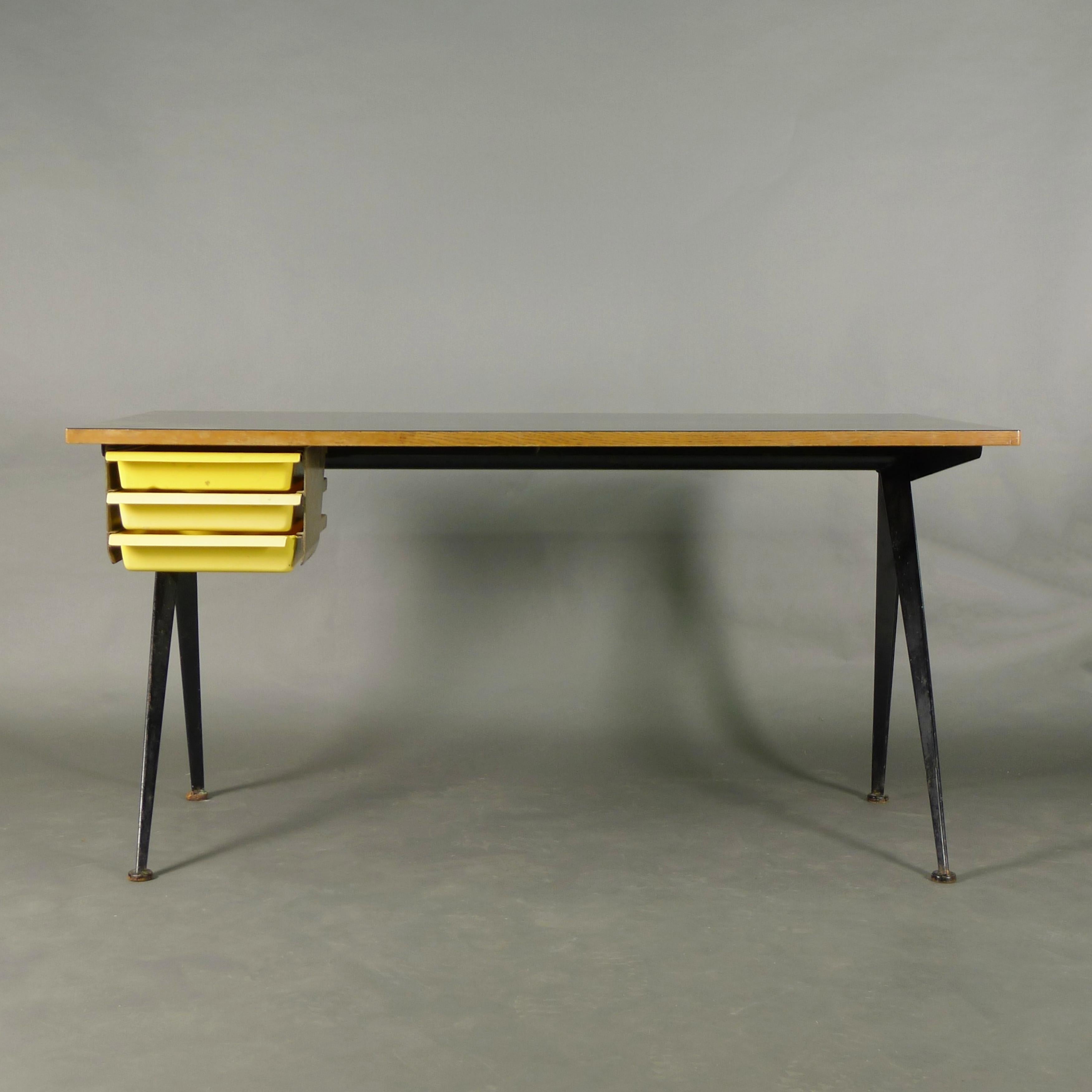 Jean Prouvé, Compas Desk, circa 1950

Black melamine laminated plywood top on black lacquered folded steel legs, with original drawer pack in yellow moulded plastic by Charlotte Perriand

72cm high, 140cm wide, 70cm deep

Provenance: 
Formerly in