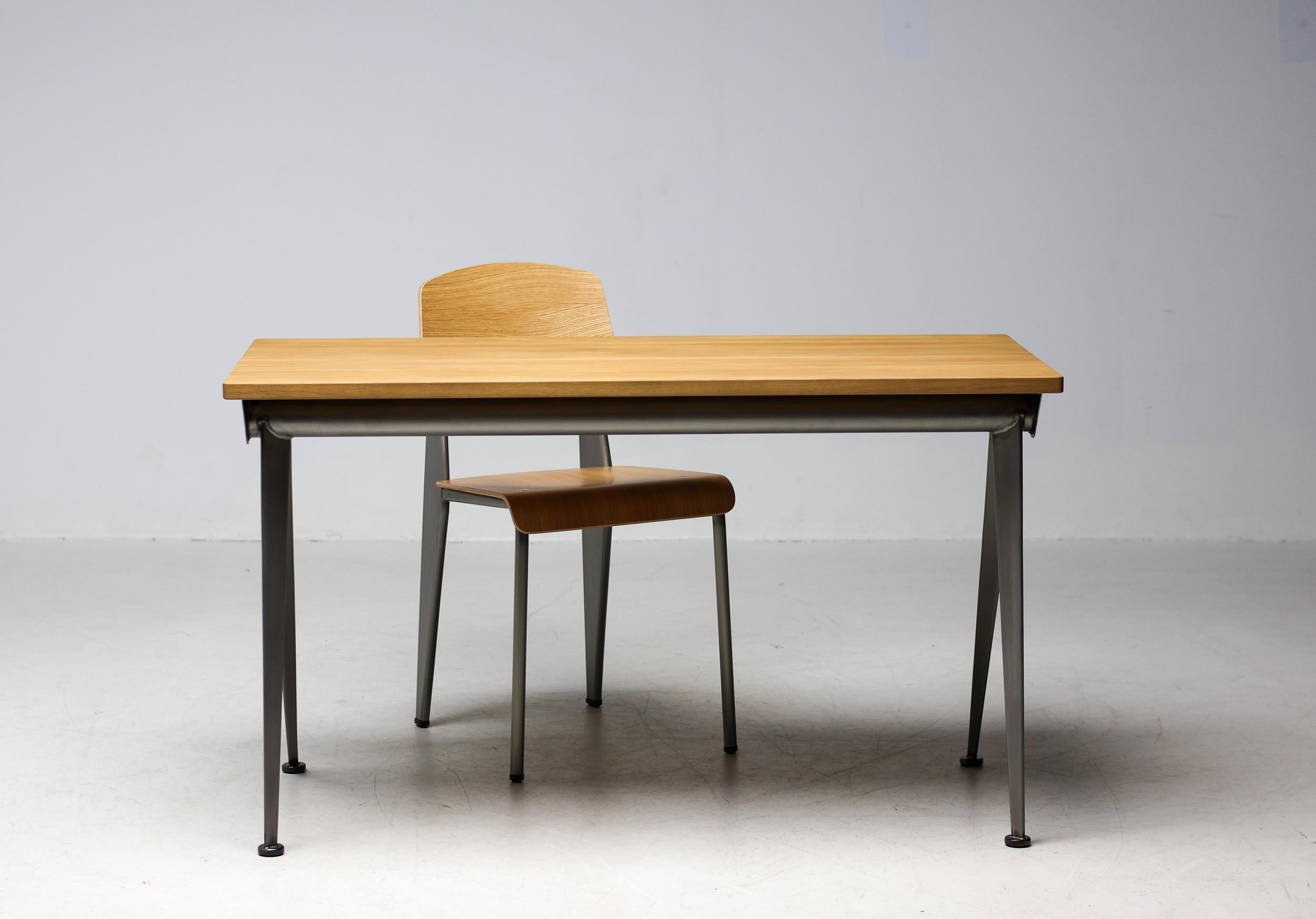 Jean Prouvé Compass direction desk in natural oak and clear lacquered steel for Vitra. Originally designed in 1953, Prouvé's iconic desk is based the design on the structural principles for which he is known. Common to all of them are the slender,