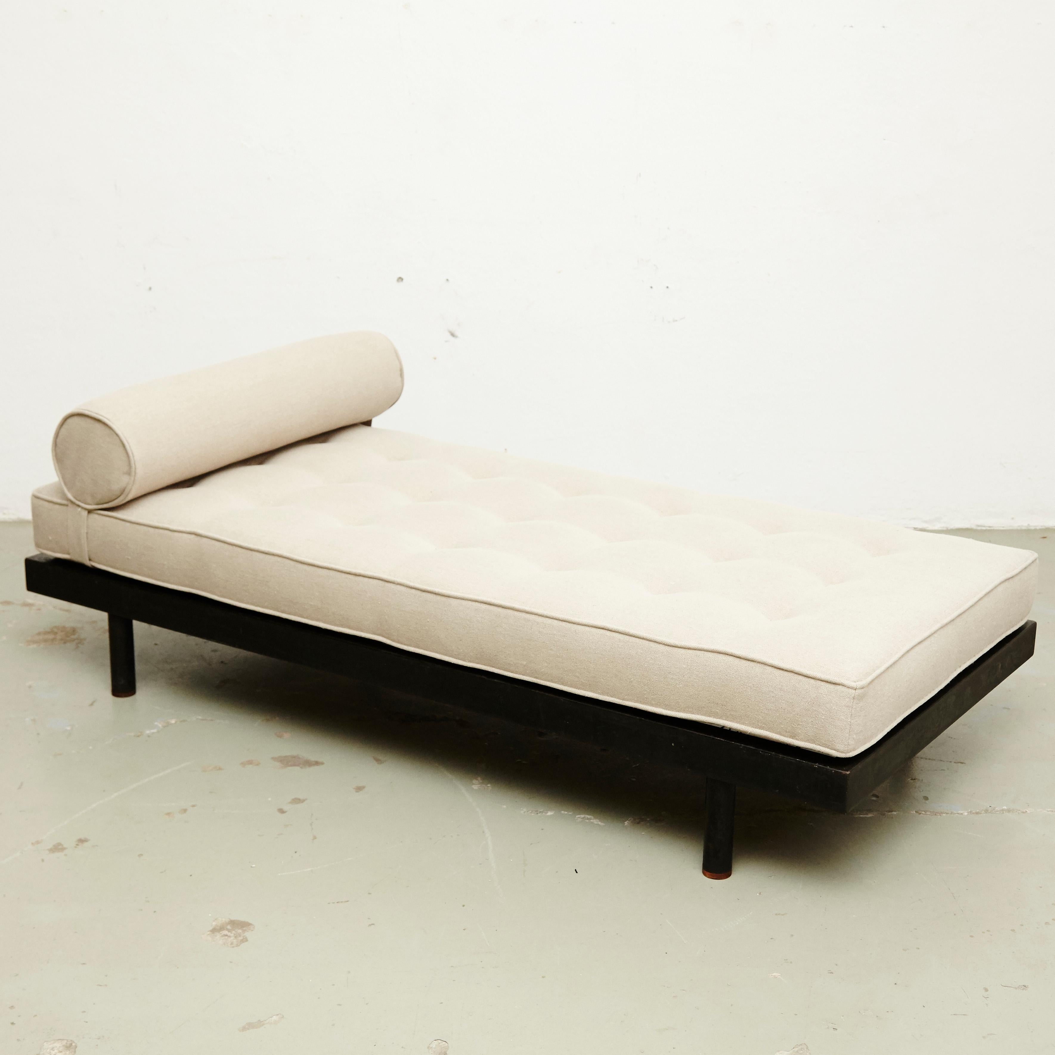 Daybed designed by Jean Prouve manufactured by Ateliers Prouve (France), circa 1950.

In good condition, with minor wear consistent with age and use, preserving a beautiful patina.
It has some traces of rust and the wood and metal has been