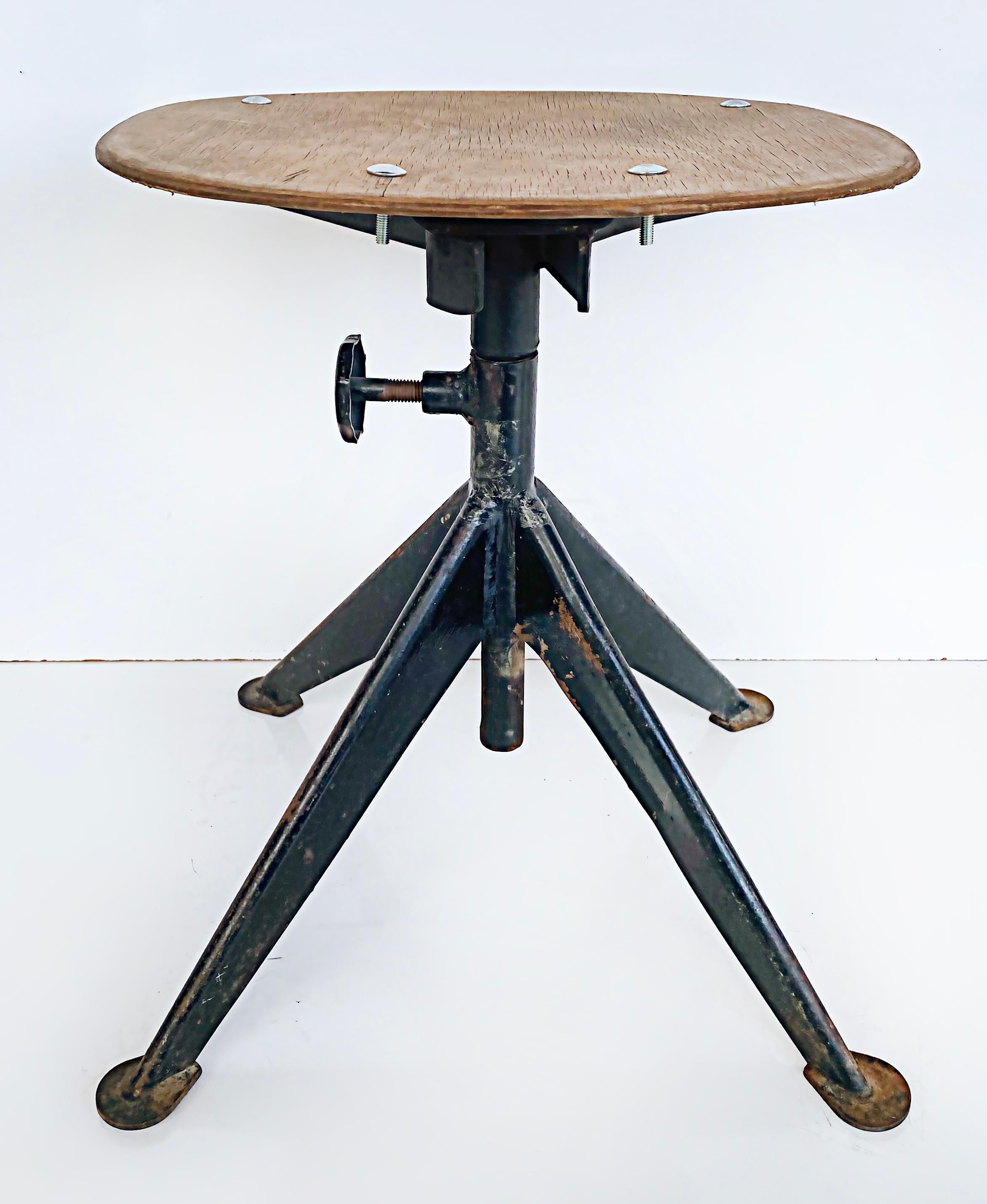 Jean Prouvé French mid-century industrial iron stools, adjustable, wood seats.

Offered for sale is a pair vintage of Jean Prouvé French mid-20th century adjustable industrial iron and wood stools. These stools were acquired in France by the