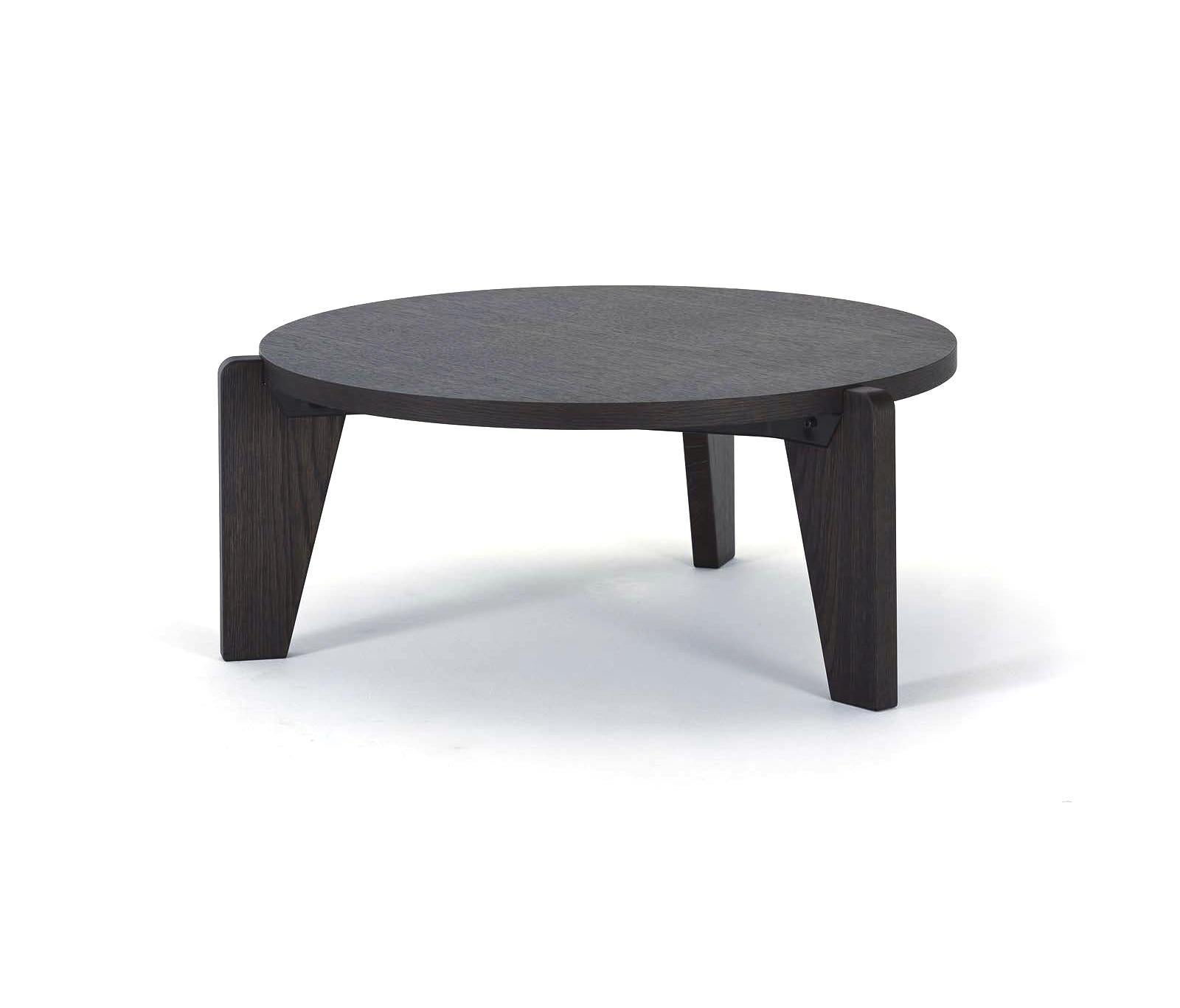 Jean Prouvé guéridon bas coffee table in smoked oak for Vitra. Designed in 1944, the guéridon bas is an early masterpiece by the French designer and engineer Jean Prouvé. Due to the wartime scarcity of metal, the guéridon bas was constructed almost