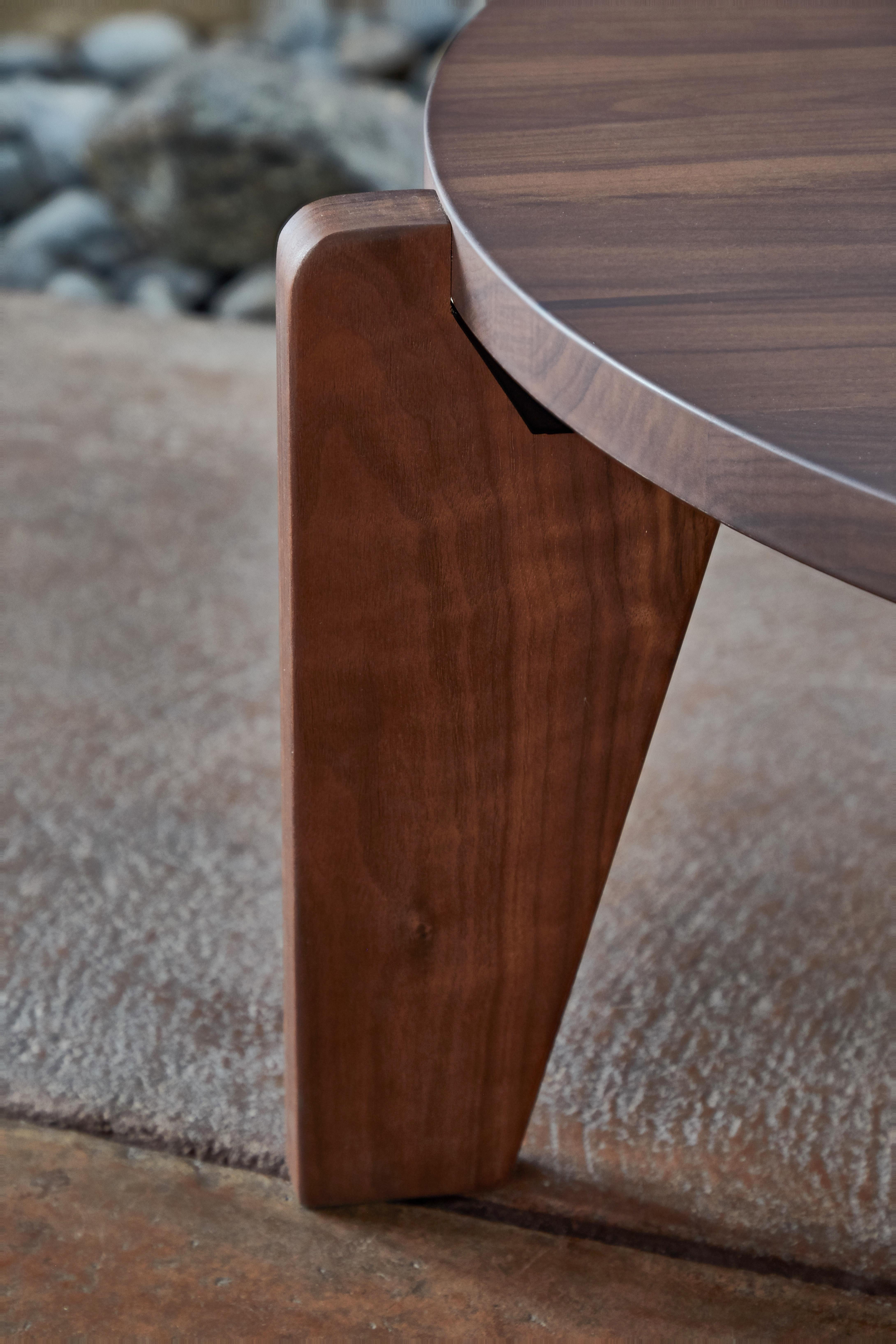 Jean Prouvé Guéridon Bas coffee table in walnut for Vitra. Showroom model in like new condition. Executed in solid American walnut.

Designed in 1944, the Guéridon Bas is an early masterpiece by the French designer and engineer Jean Prouvé. Due to