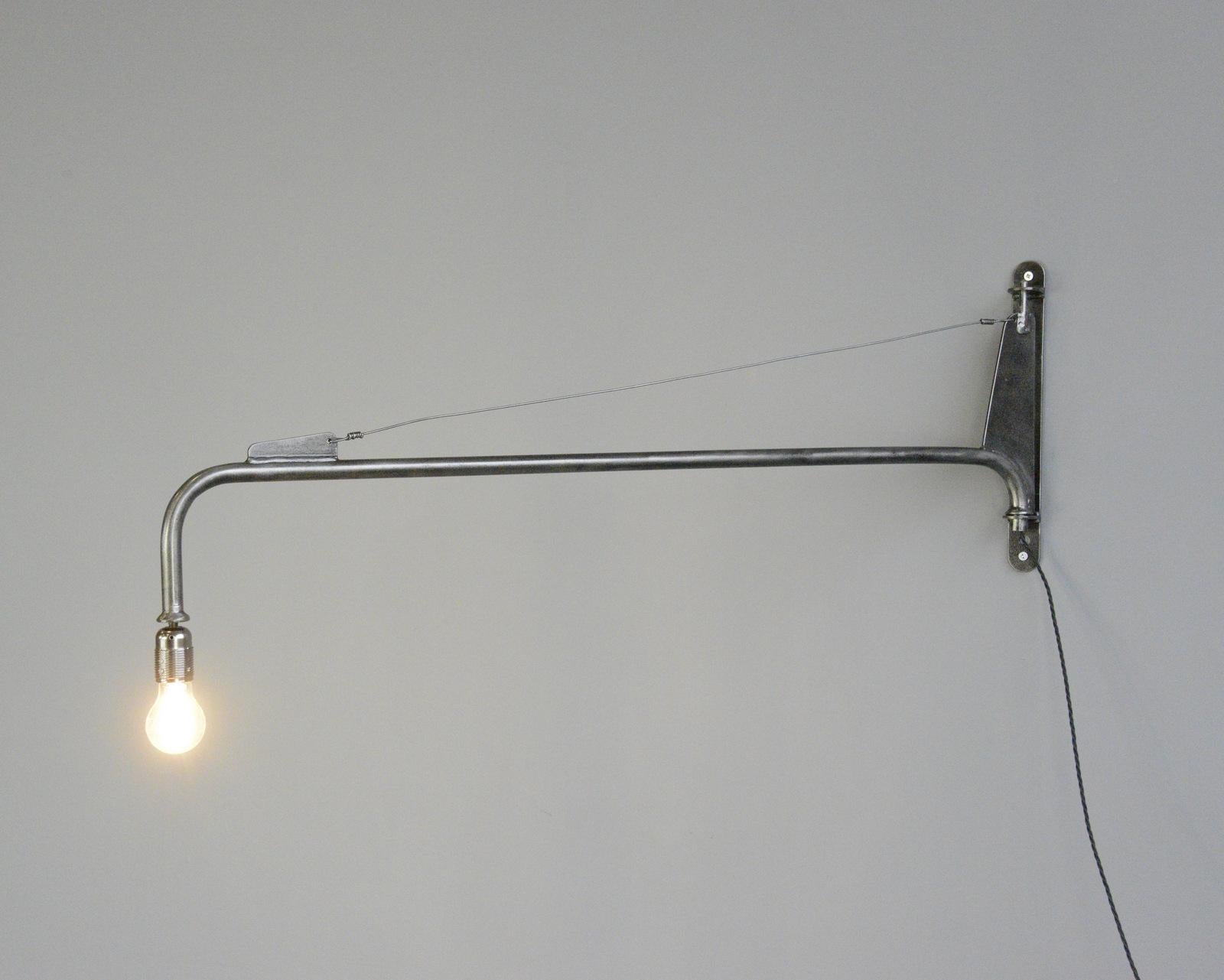 Jean Prouve jib wall lights Circa 1940s

- Price is per light (2 available)
- Takes E27 fitting bulbs
- On a remote control switch
- Swing out design based on a ships sail or jib
- Designed by Jean Prouve
- French ~ 1940s
- Measures: 6cm wide x 40cm