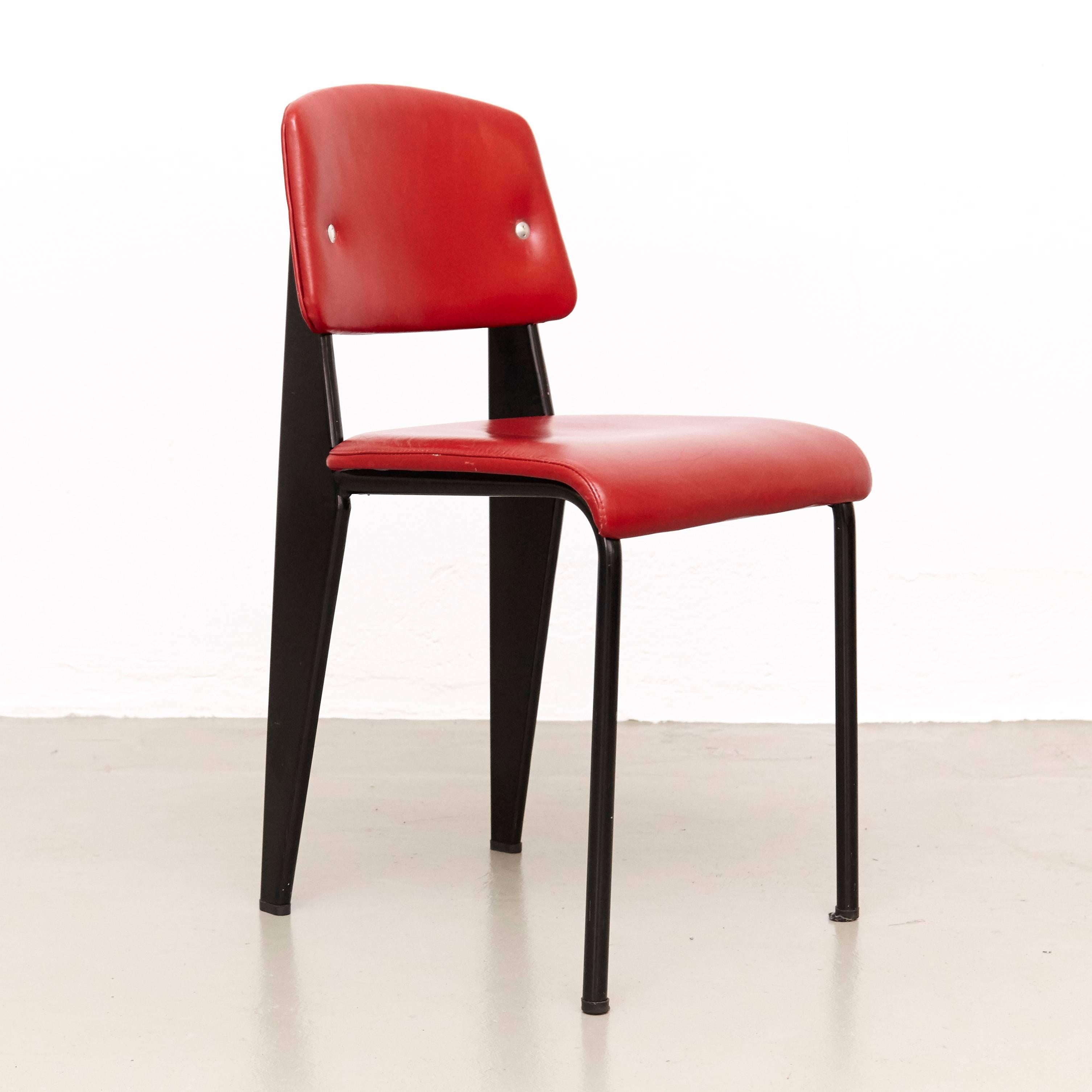 Standard chair designed by Jean Prouvé.
Manufactured by Ateliers Prouve, France, circa 1950.
Model 305 in wood, upholstered in red many years ago by the previous owner.

The standard chair was commissioned for the social security meeting rooms