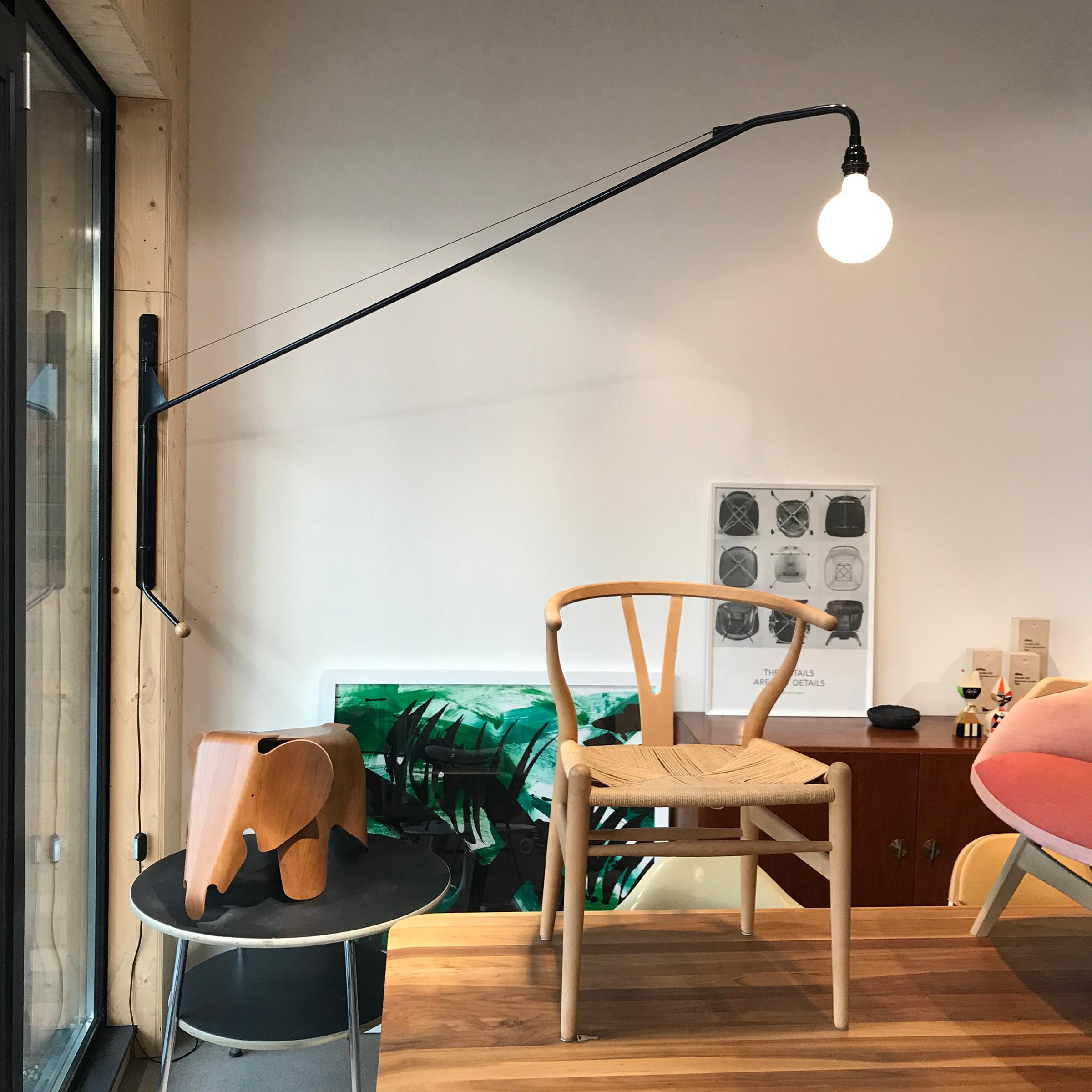 Industrial and minimalistic wall lamp designed by Jean Prouvé and produced by Vitra. The Potence swiveling wall lamp was designed by Jean Prouvé for the 'Maison Tropique' and is considered a purist masterpiece. What makes this lamp special is the