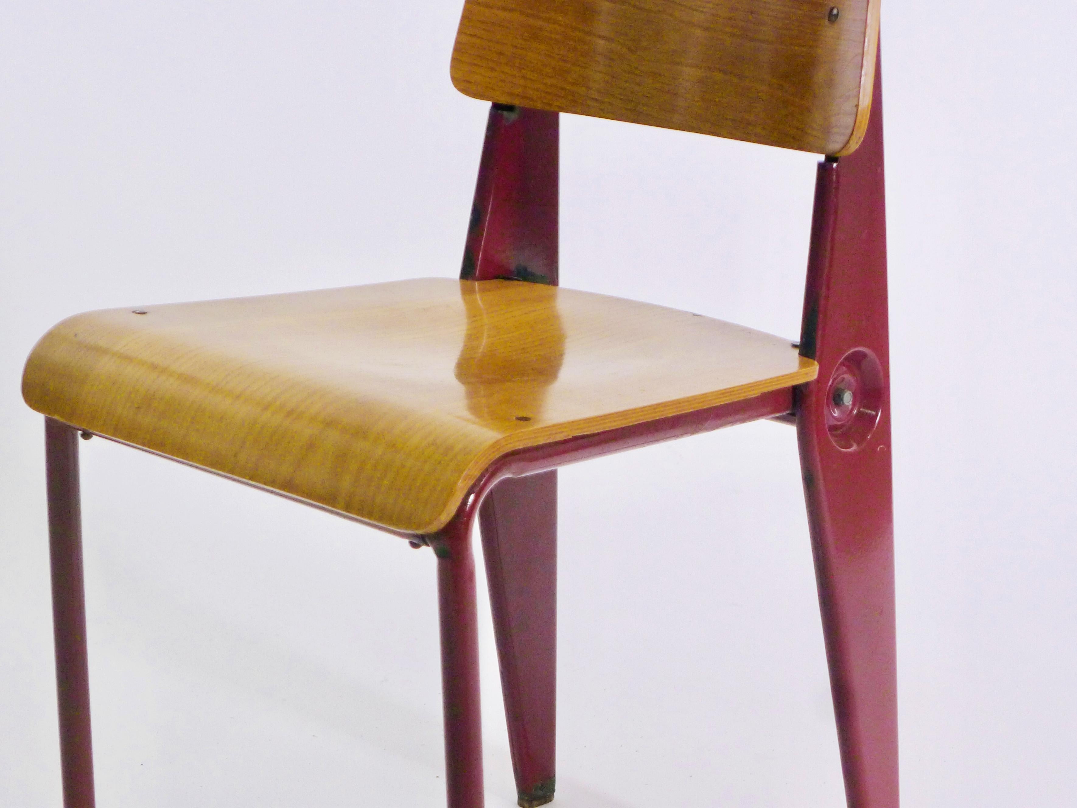 Jean Prouvé (1901-1984)
'Démontable' Chair, Model No. 300, circa 1950-2
manufactured by Atelier Jean Prouvé, Nancy, France
ash plywood, folded steel sheet and tube enamelled in original 'Brun Van Dyck' red
81cm high, 40cm wide, 47cm deep, seat