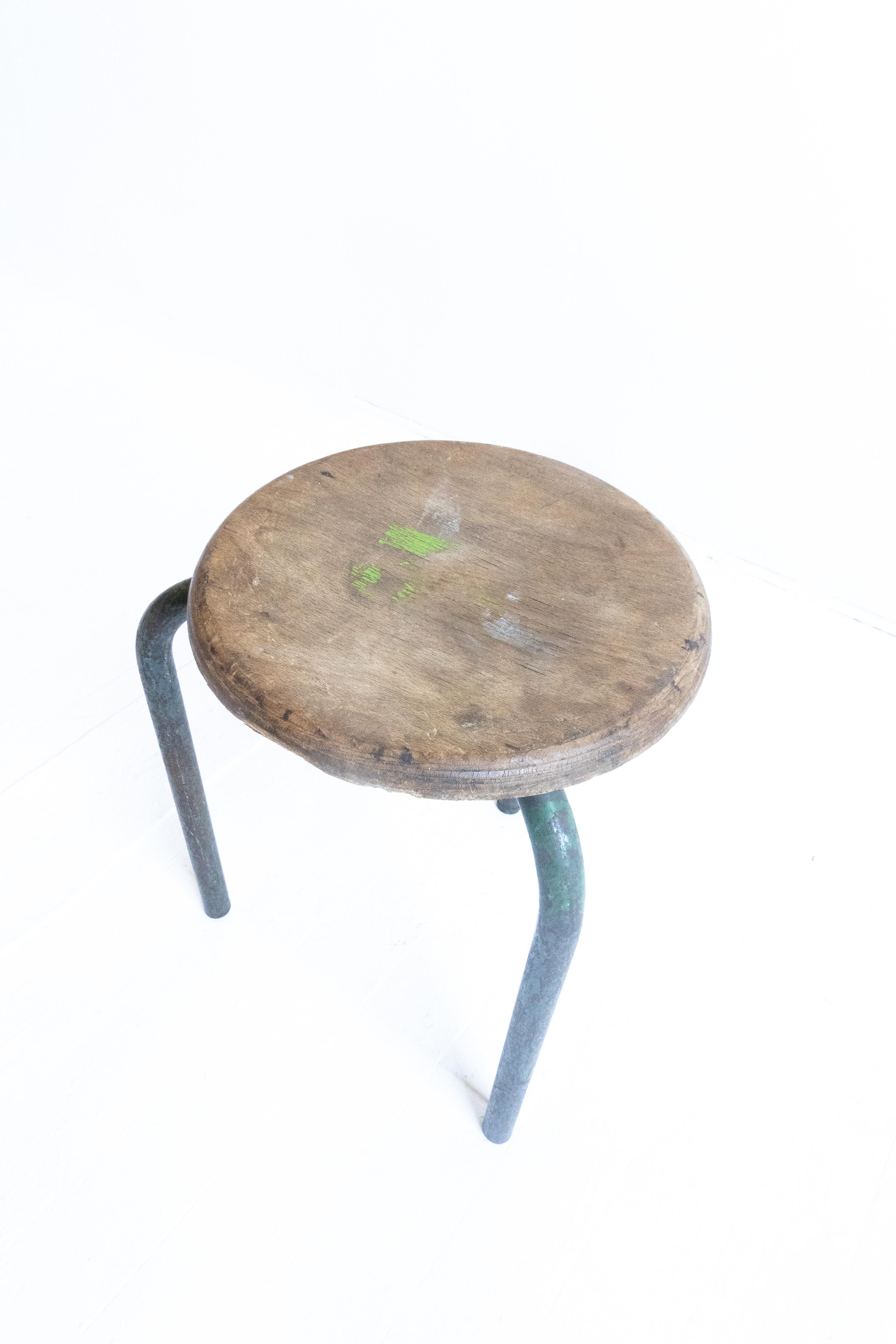 Tripod stool attributed to Atelier Jean Prouvé. Designed for local schools in France in the 1940s. 

Lacquered green metal base and plywood seat. Beautiful patina. 

The Lycée Fabert is a senior high school in Metz, Moselle department, Lorraine,