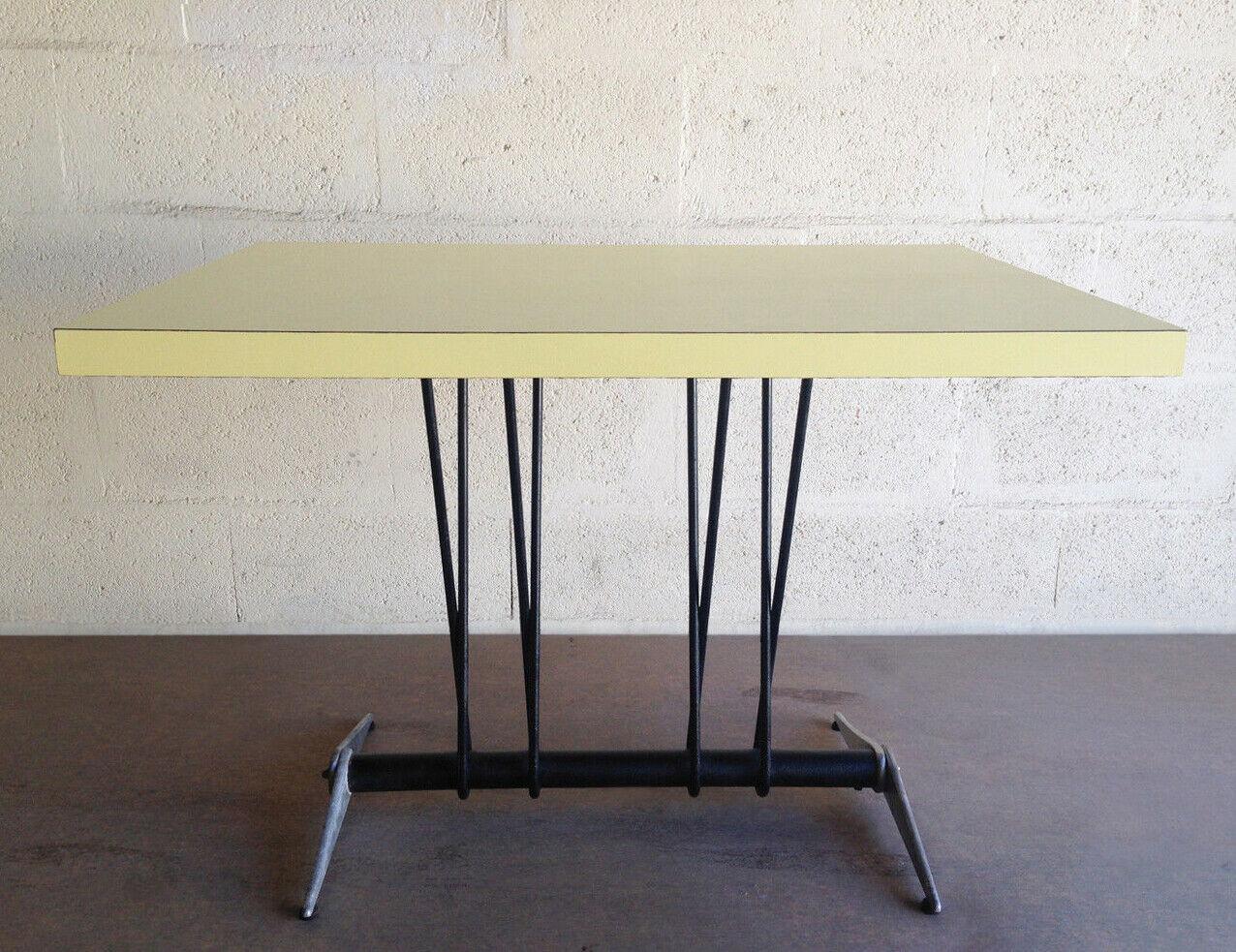 Jean Prouvé
Rectangular table for the Aero Club of Doncourt-les Conflans
yellow melamine wood on black lacquered curved metal base on a double winged base in chromed aluminium fibre,
circa 1938
H 72 x L 100 x W 69
Rare and historic
3,900 Euros.