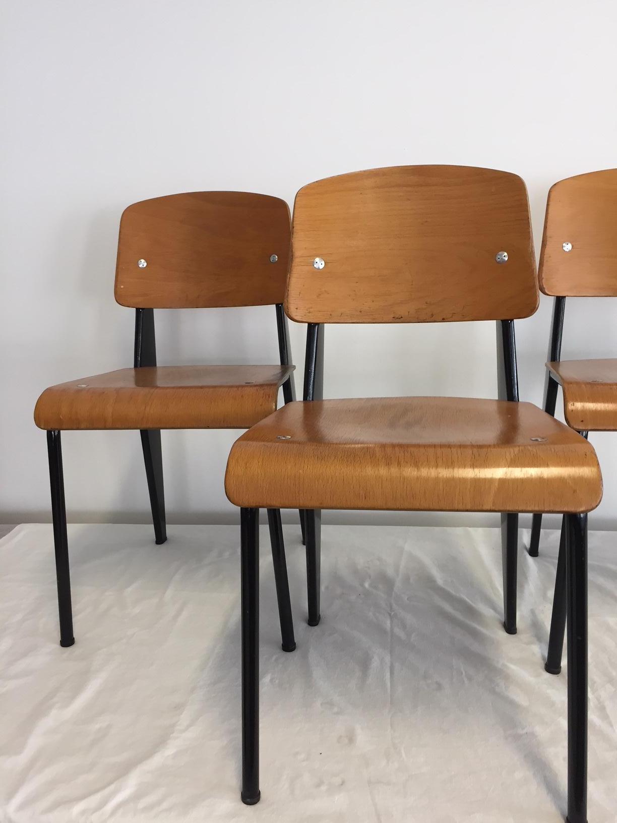 'Semi-Metal' No. 305 chairs by Jean Prouve, and manufactured by Ateliers Jean Prouvé, France, circa 1950. Enameled steel color black and beech plywood. Provenance Galerie DownTown / Francois Laffanour.