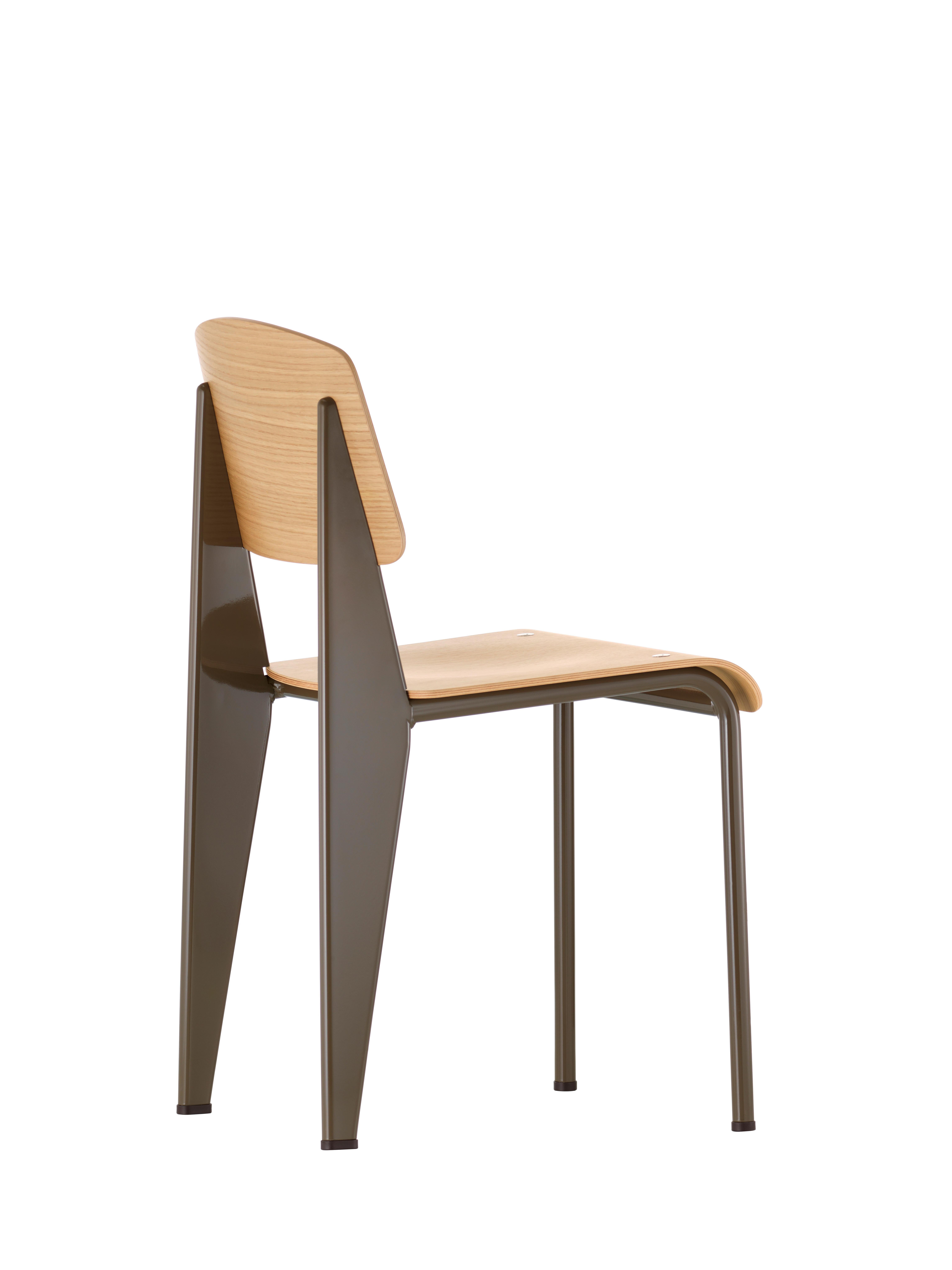 Jean Prouvé Standard chair in natural oak and black metal for Vitra. The Standard chair is an early masterpiece by the French designer and engineer Jean Prouvé. Originally designed in 1934, the Standard evolved into one of the most famous classics