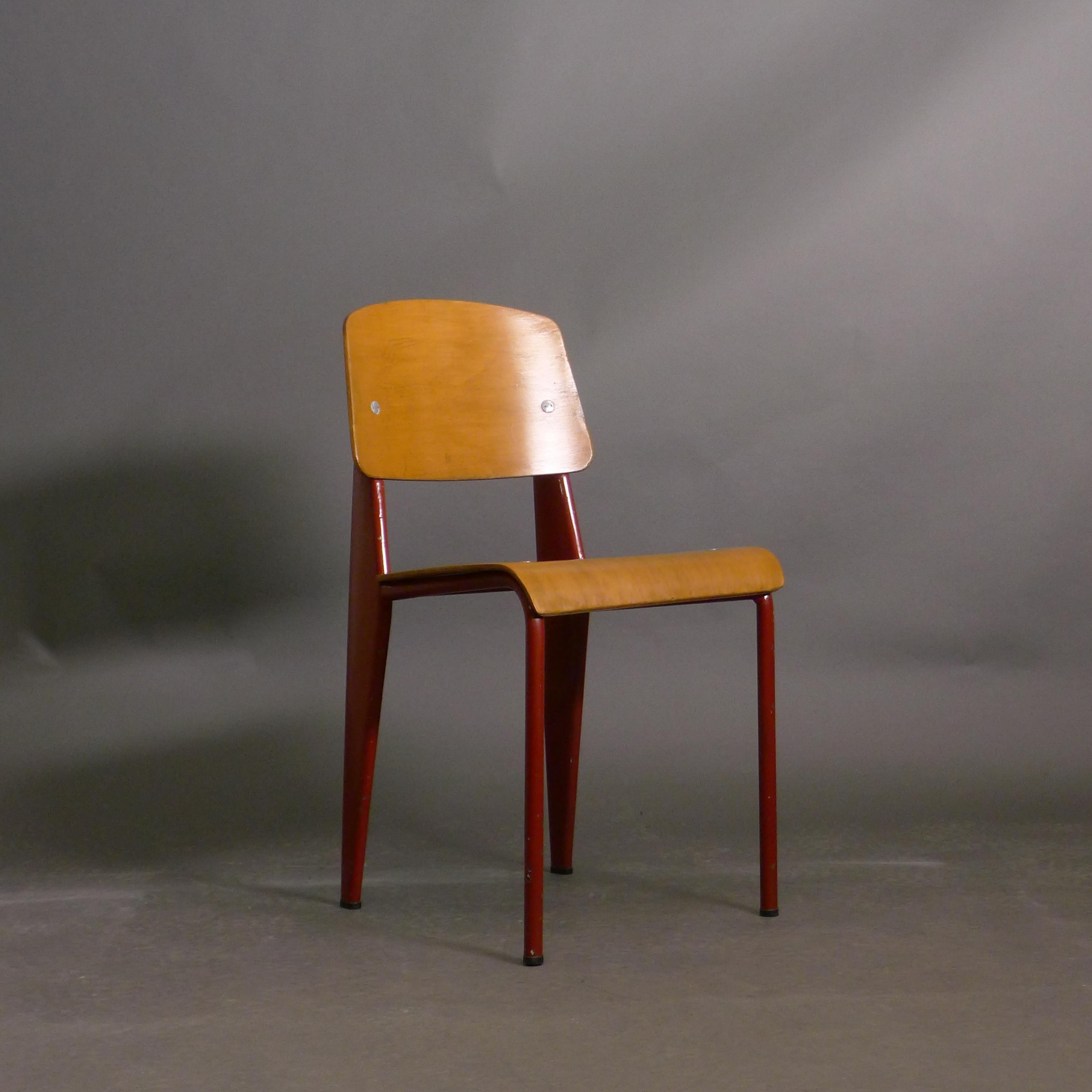 Jean Prouvé, Standard Chair, known as model Metropole N. 305

Red painted folded and tubular steel structure with beech plywood back and dished seat, manufactured by the Ateliers Jean Prouvé in Nancy, France

81.5cm high, 41cm wide, 48cm deep, seat