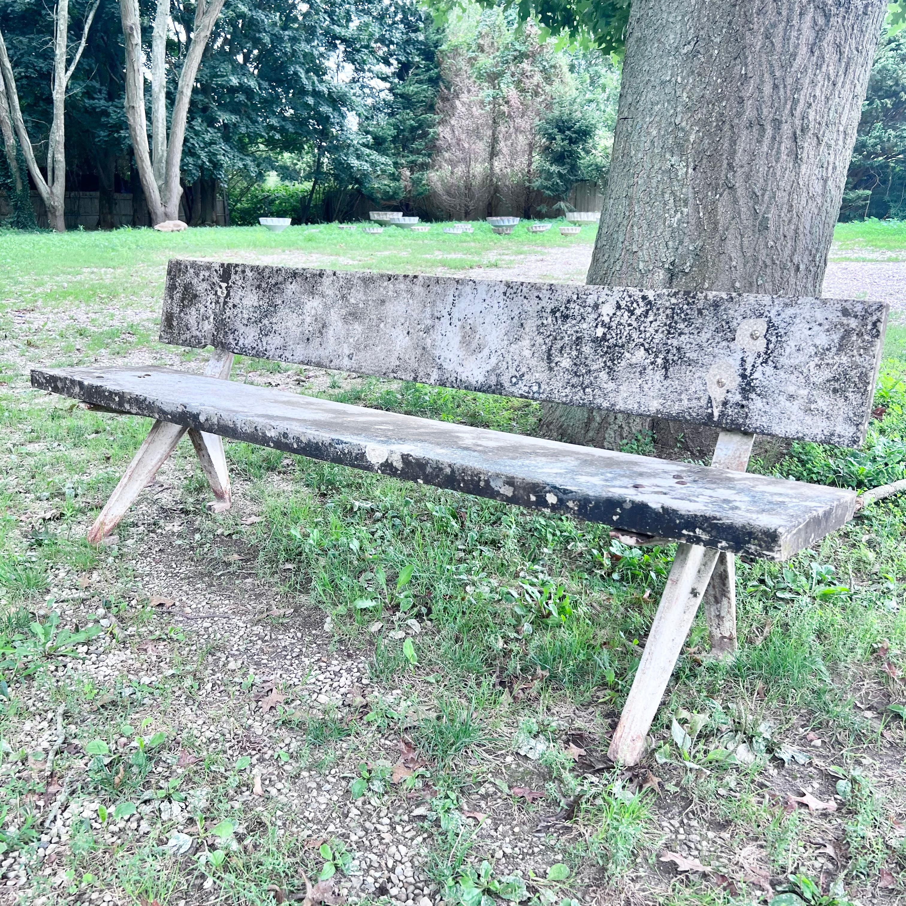 Stunning pair of Jean Prouvé style concrete benches from France, circa 1960. Very similar to Prouvé’s iconic ‘Marcoule’ bench from 1953, these benches were clearly designed and fabricated as a wonderful homage to the master architect/designer. Years