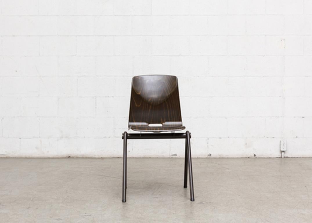 Tubular enameled metal frame with wenge toned seating with hole cut-out in seat. 
Jean Prouve Style Stacking School or Restaurant chairs with wenge toned seating with cut-out detail in seat back. and Brown Enameled Tubular Metal Frames. Seating