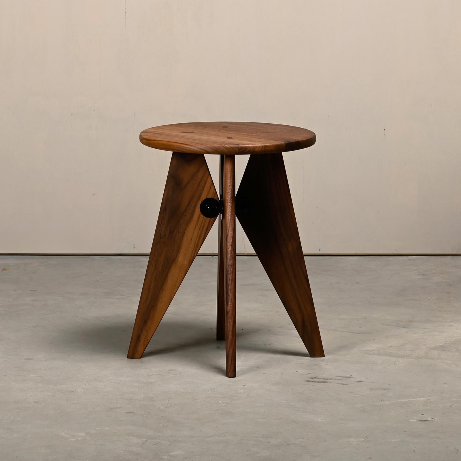 The Tabouret Bois (Solvay) is designed by Jean Prouvé and manufactured by Vitra. The design of the Tabouret Bois clearly bears the signature of Jean Prouvé. The shape is based on the structural requirements of the object and it can also be used as