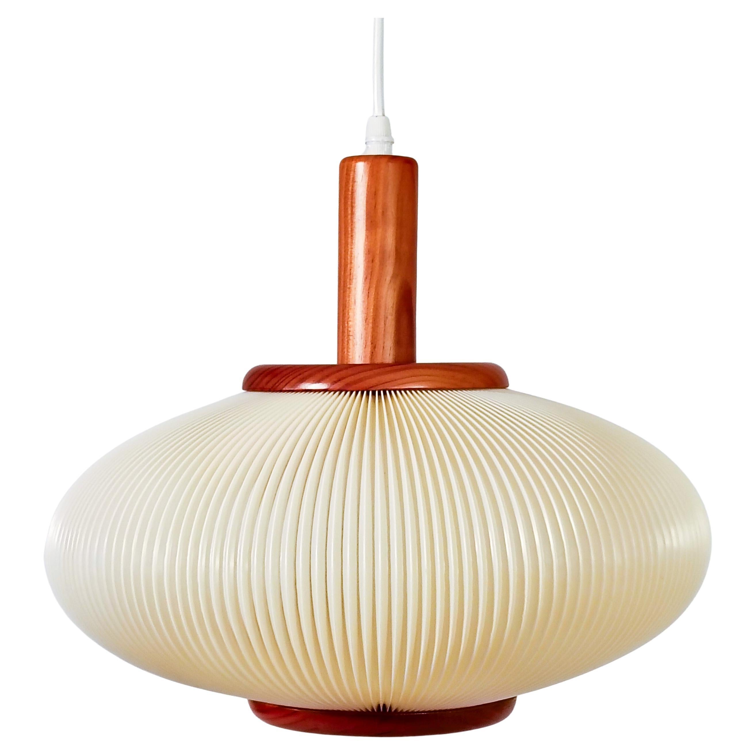 How high should a chandelier be from the table?