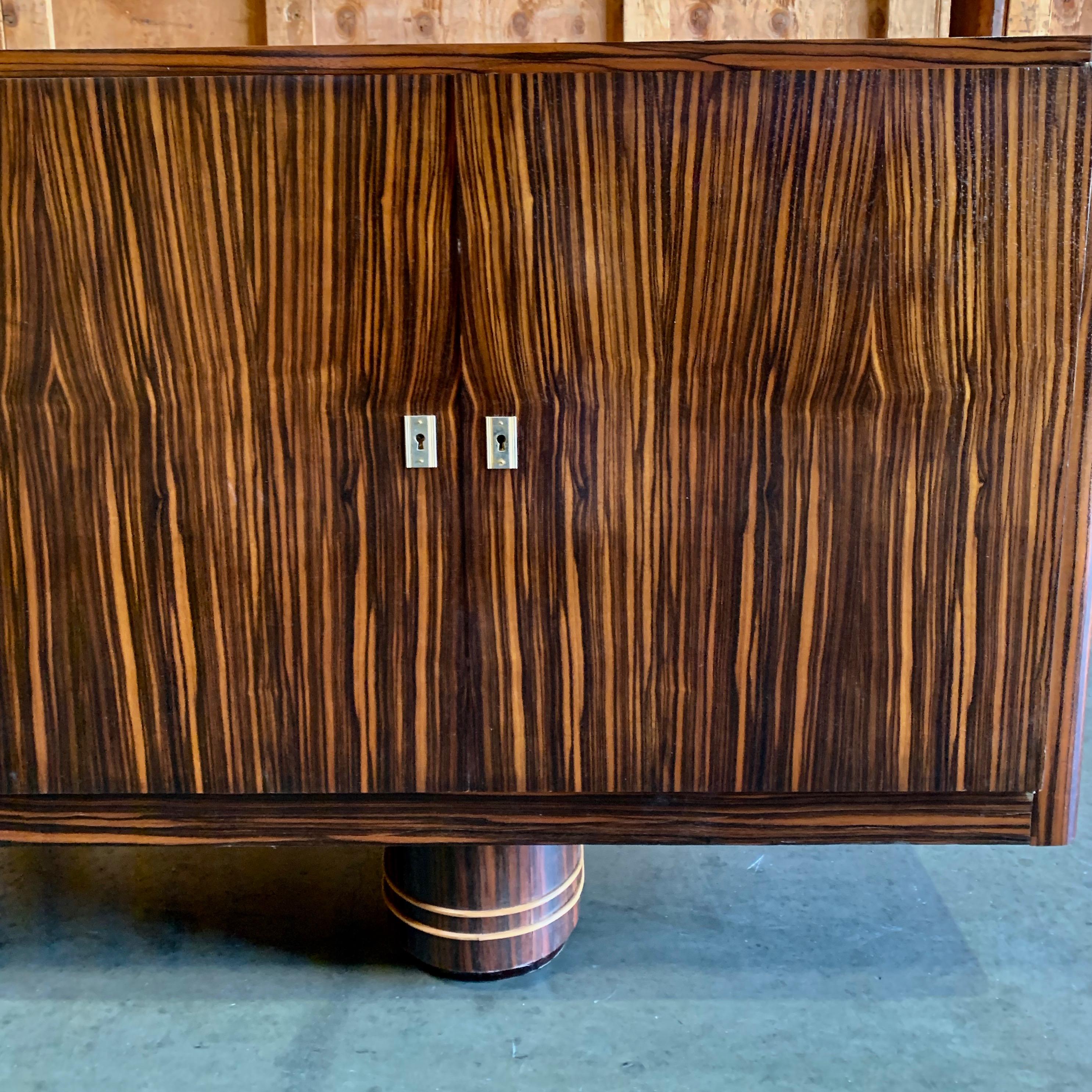 Jean Royère mahogany Credenza cabinet console purchased at auction with integrated bar detail and impeccable pedigree.