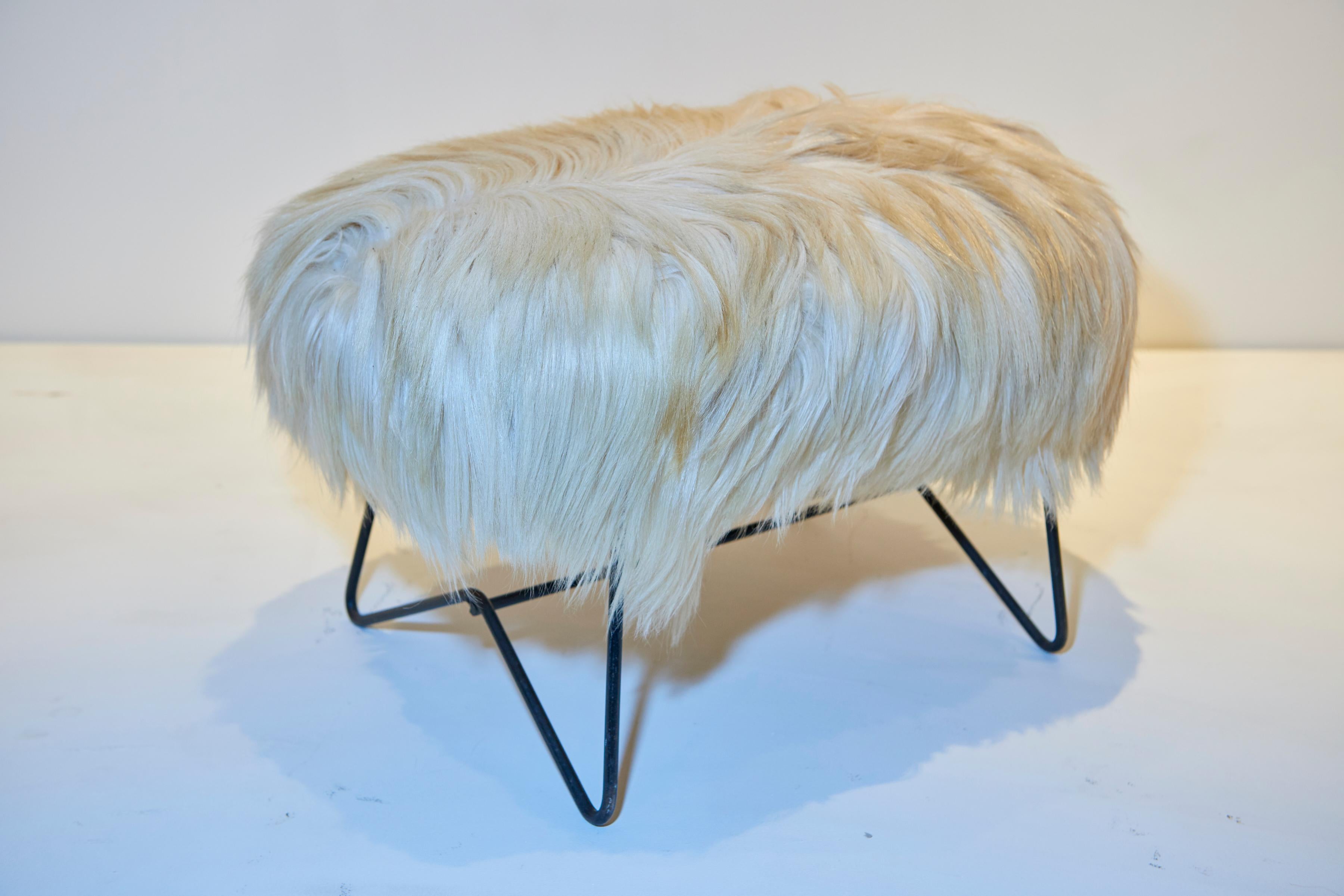 A wonderful Jean Royère goat fur stool.