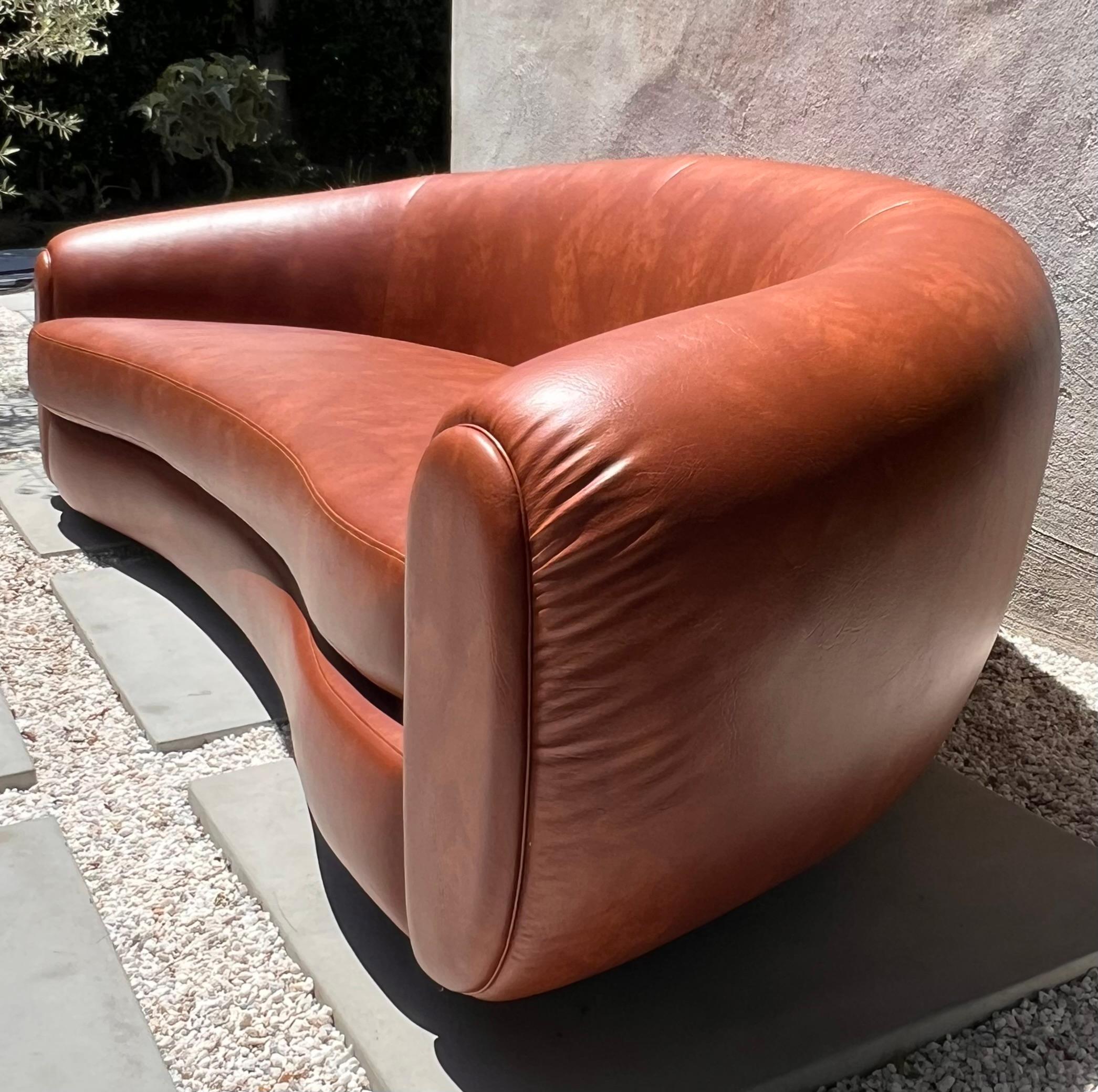 Post-Modern Jean Royère style curvy cognac pleather sofa, 21st century  For Sale