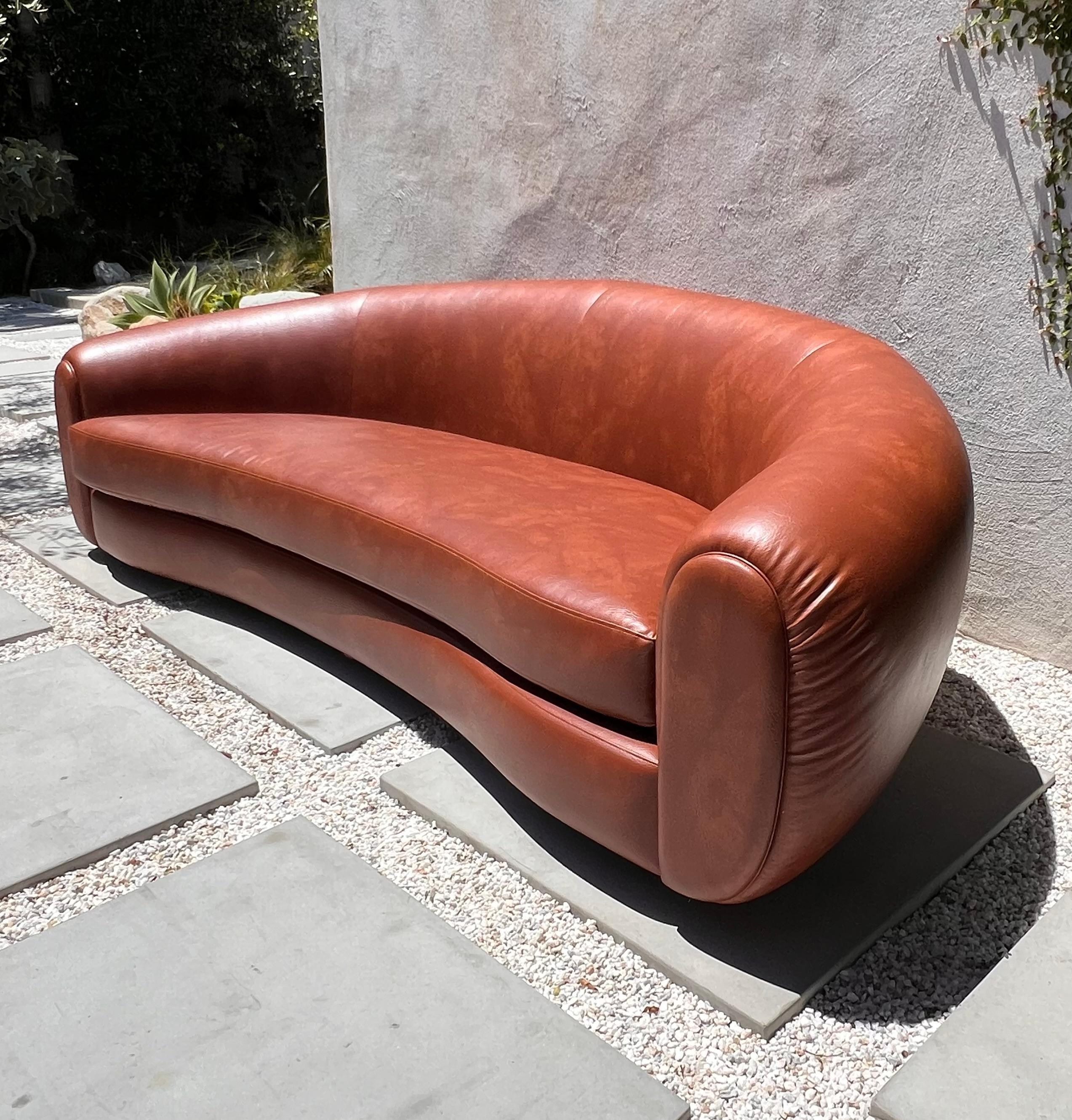 Faux Leather Jean Royère style curvy cognac pleather sofa, 21st century  For Sale