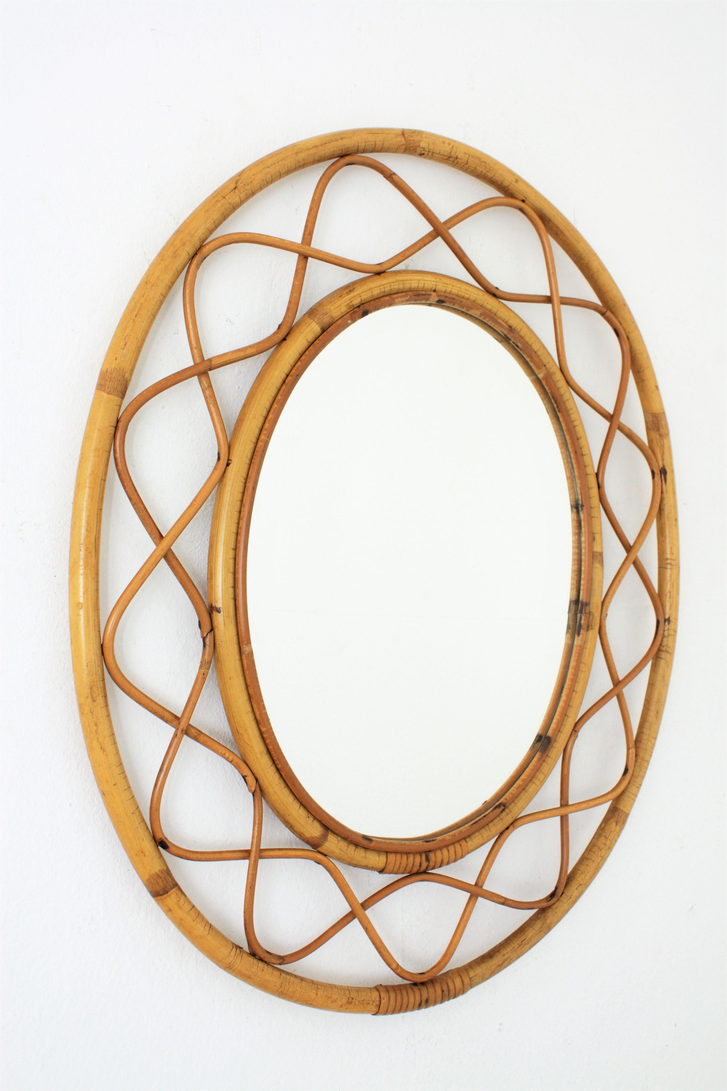 Lovely handcrafted bamboo and rattan oval mirror with all the taste of the Mediterranean coast style. In the style of Jean Royère.
Gorgeous to place it alone and also beautiful creating a wall decoration with other mirrors in this manner. France,