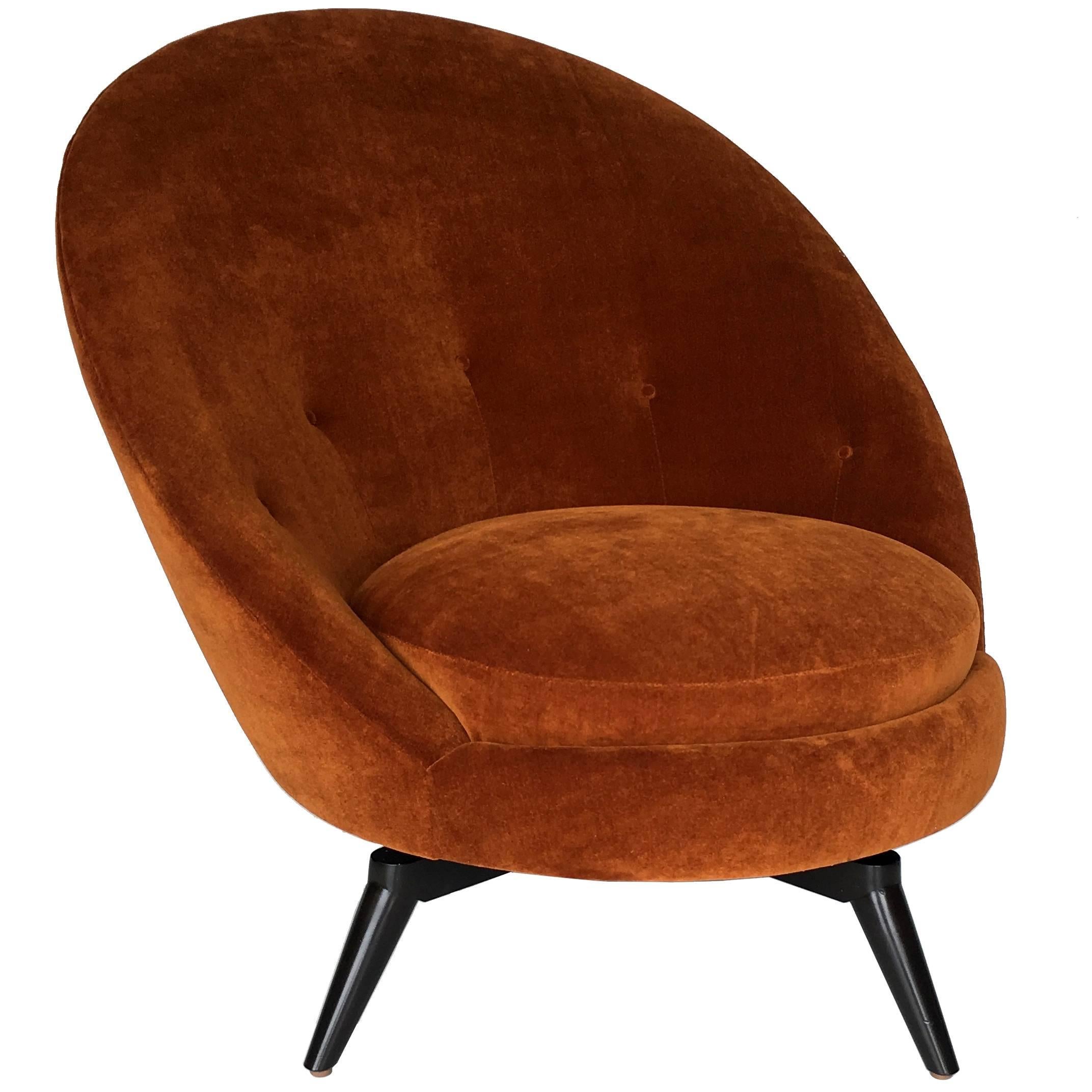 Swivel egg chair in the French midcentury style. This sophisticated chair has been freshly upholstered in heavy-weight, backed burnt orange/gold velvet. This super stylish and versatile example is as comfortable as it looks and is painstakingly