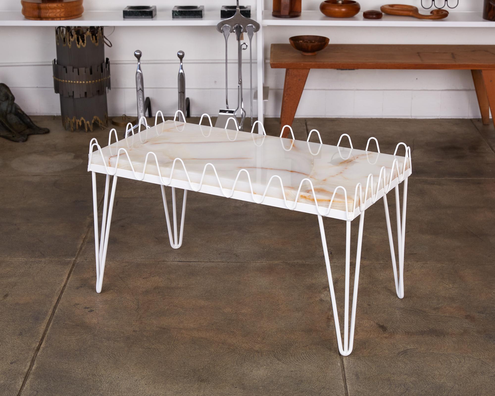 Freshly powder coated in a crisp white, this coffee table with a new onyx top can be used in or outside. An iron scallop 