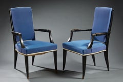 Jean Saint-Georges, Sillones de madera ennegrecida, tapicería azul, circa 1940