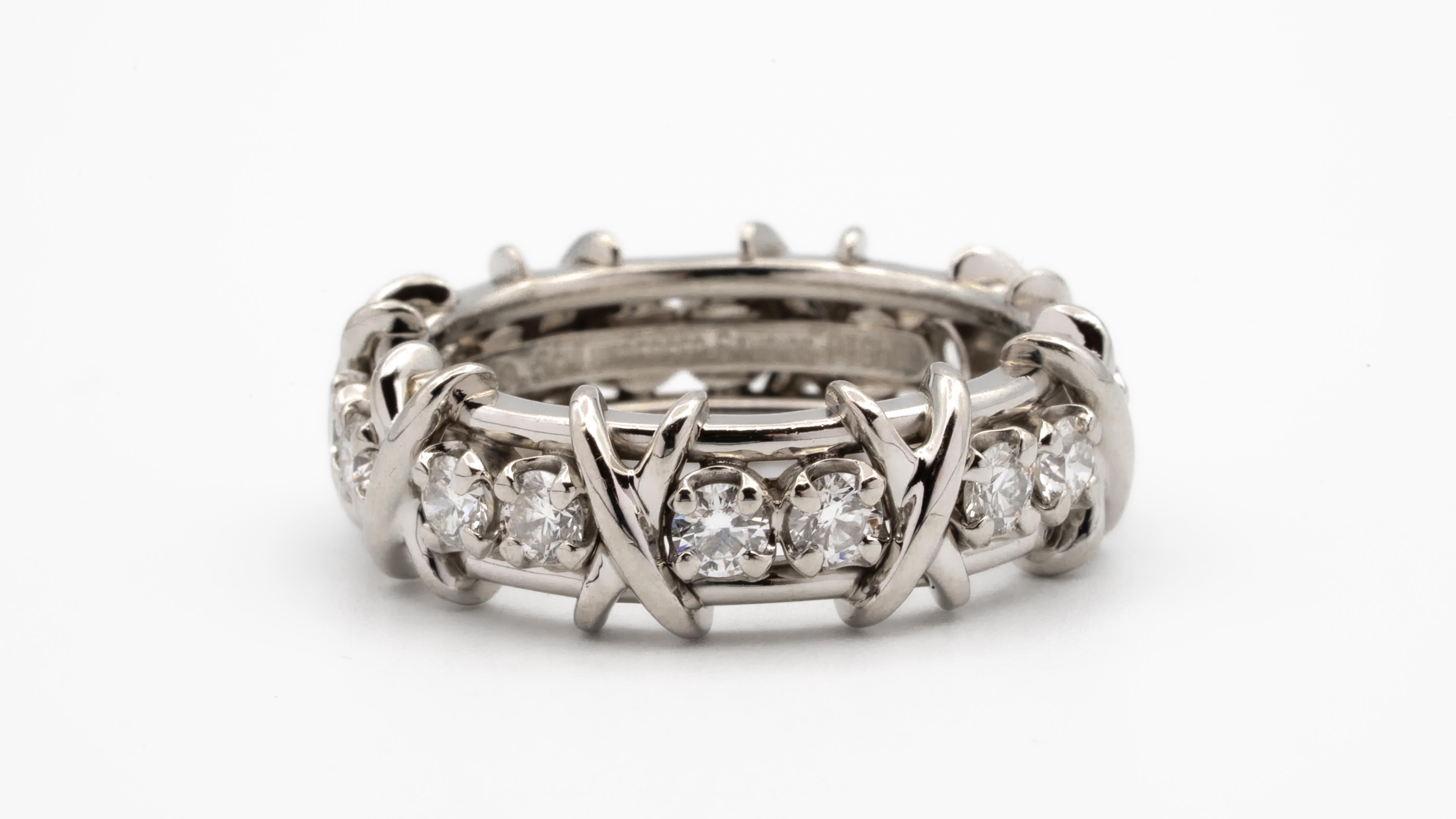 Tiffany & Co. Schlumberger Studios 16 stone ring, finely crafted in all Platinum with 16 round brilliant cut diamonds weighing 1.15 carats total weight approximately. F color , very fine VS clarity.

Stamp: Tiffany & Co Schlumberger Studios,