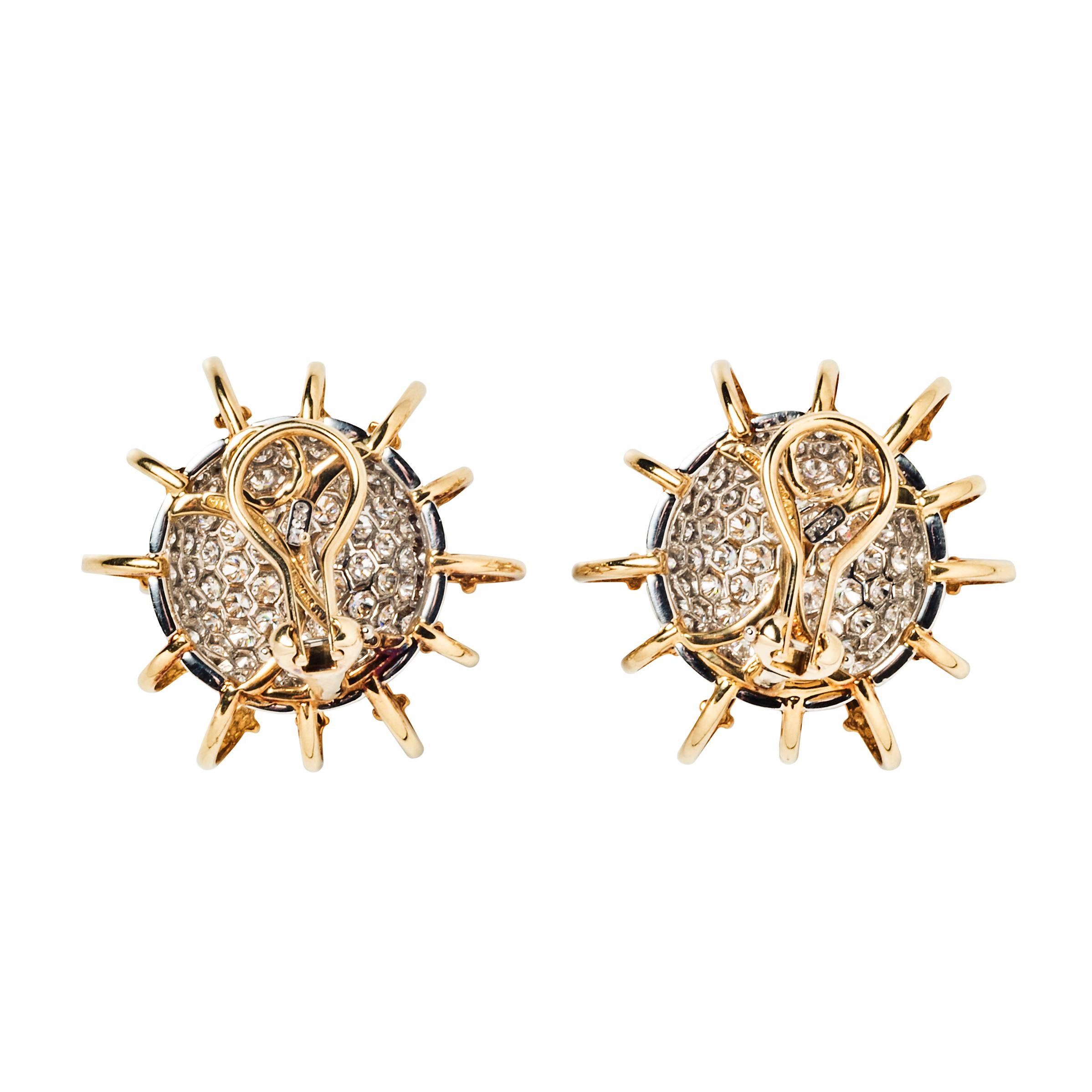 Jean Schlumberger’s Apollo earrings take their visual inspiration from electrons circling an atom. Of bombé-style, they are set with pavé diamonds and surrounded by 18k yellow gold looped wire.

- 1.29” in diameter
- Approximately 5.69 carats of