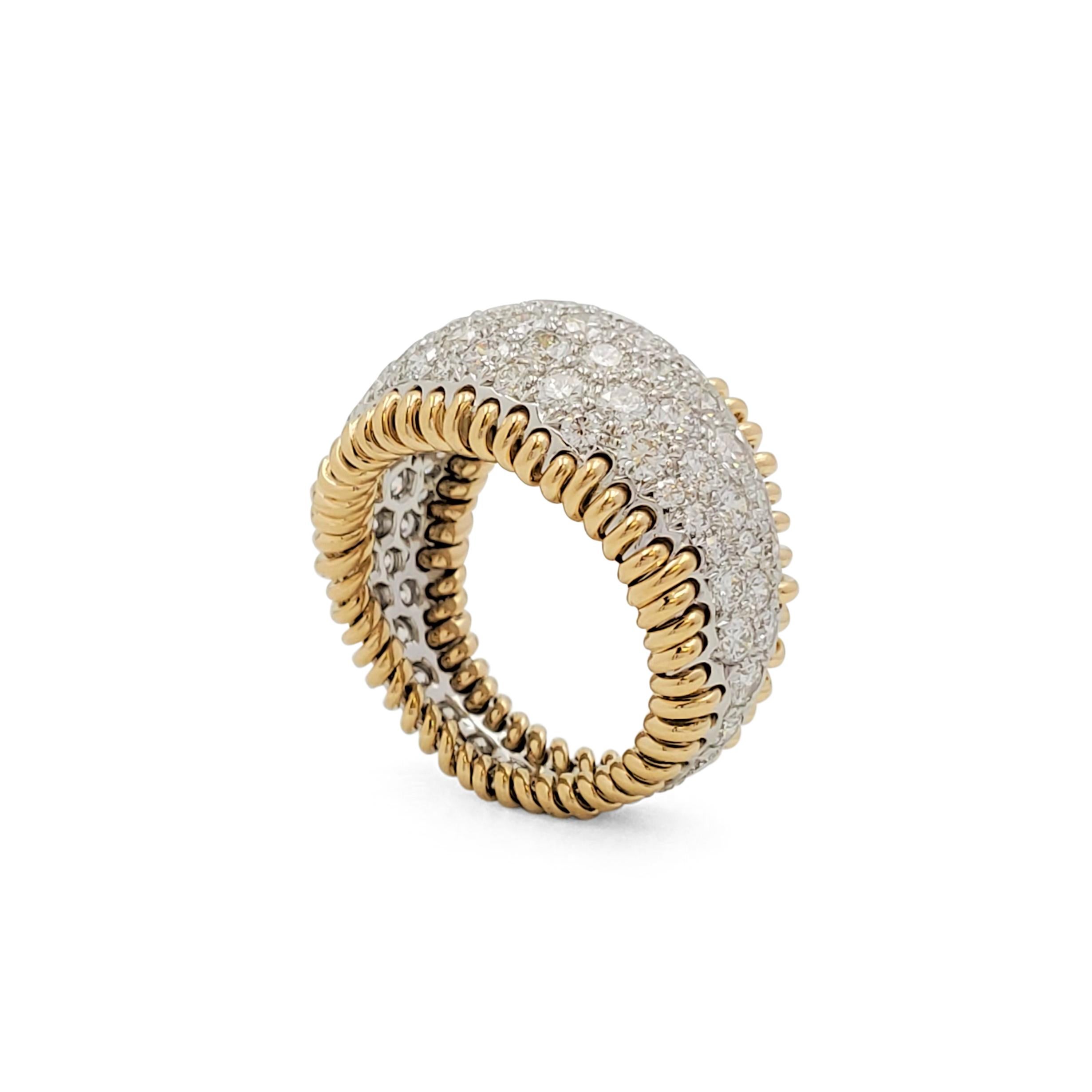 Authentic Jean Schlumberger design for Tiffany & Co. The wide bombé band is pavé-set with sparkling round brilliant cut diamonds weighing an estimated 4.00 carats (E-F, VS), mounted in platinum, between 18 karat yellow gold borders in “stitch”