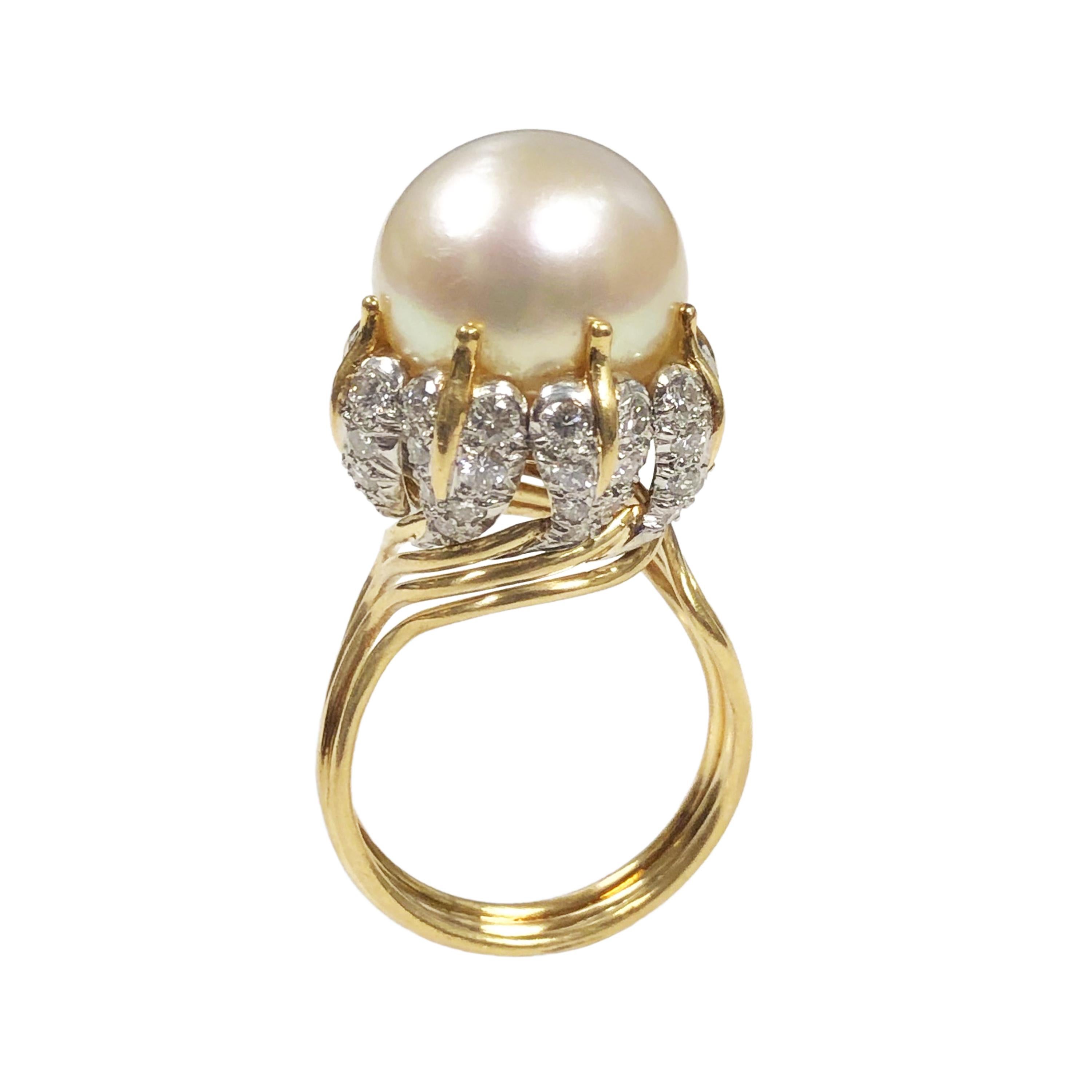 Circa 1990s Jean Schlumberger for Tiffany and Company 18K yellow Gold and Platinum Ring, Centrally set with a 13.5 MM south sea Pearl of very fine white color with a light pinkish luster. The top of the ring measures 5/8 inch in diameter.  Diamonds