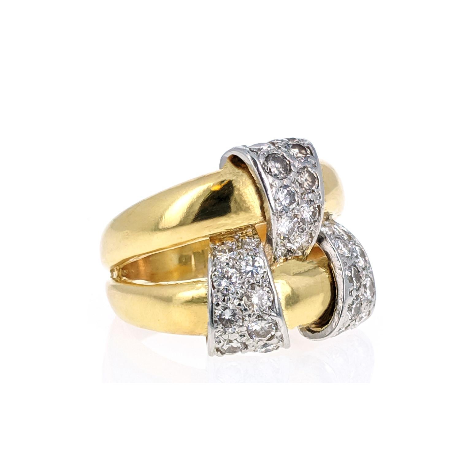 A diamond and platinum element is woven through 2 18k yellow gold bands. With 28 round-cut diamonds of approximately 0.6 carats. Signed Tiffany Schlumberger and stamped Made in France. Circa 1960s. Size 6.5. 

This is a very chic and easy to wear