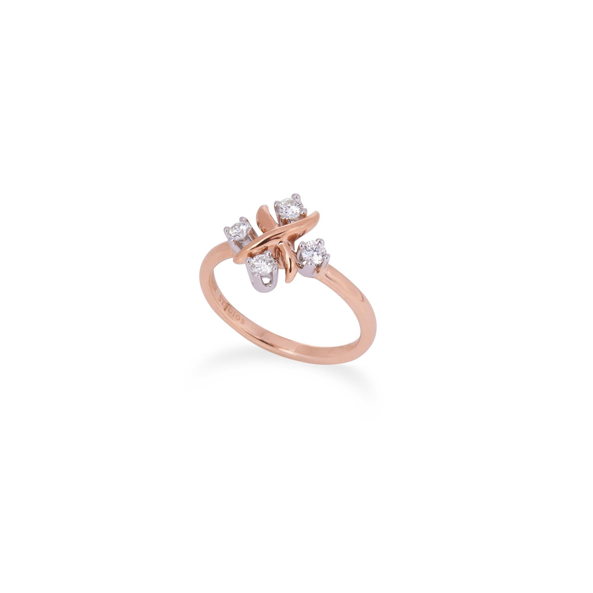 Authentic Jean Schlumberger for Tiffany & Co. Lynn ring crafted in 18 karat rose gold and platinum.  The 'X' design is set with four round brilliant diamonds of an estimated .20 total carats.  US size 5 1/2.  Signed Schlumberger Studios, Tiffany &