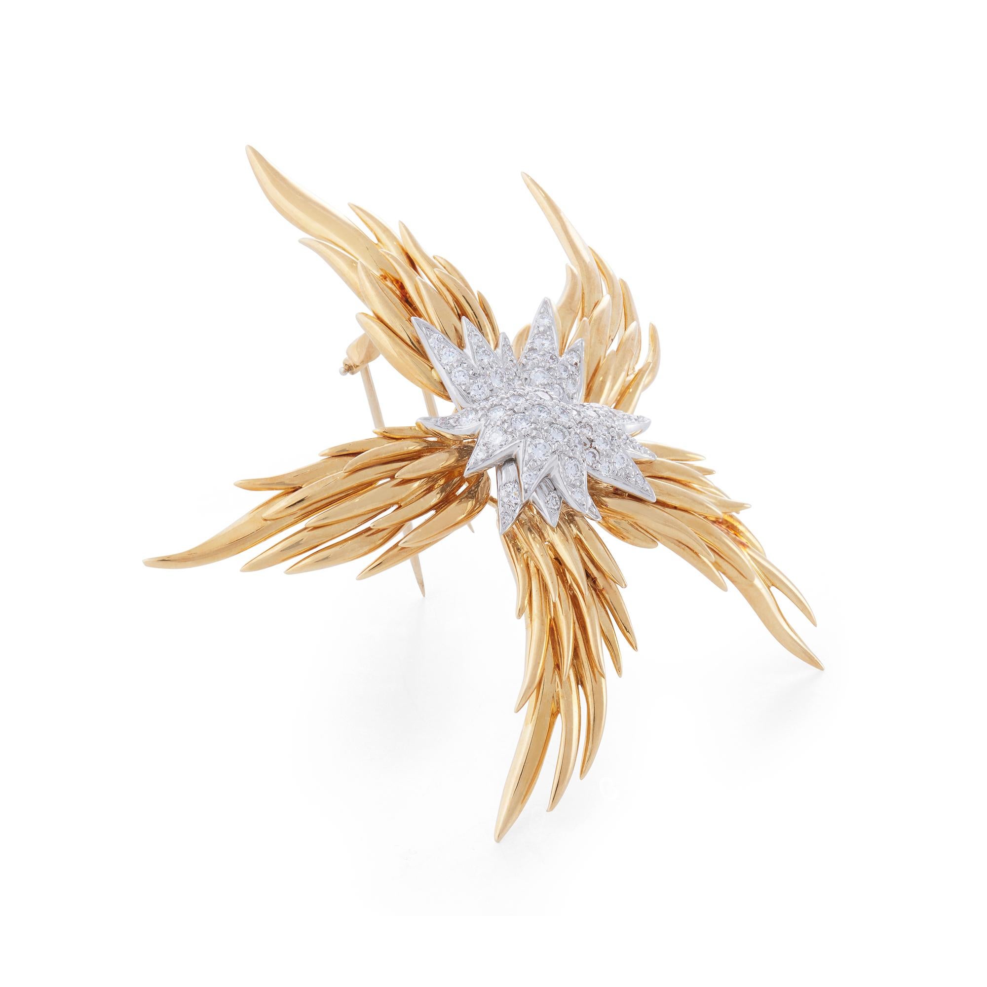 Authentic Jean Schlumberger for Tiffany & Co. Paris Flames brooch crafted in 18 karat yellow gold and platinum. Designed as a star- shaped flame and enhanced by 63 round brilliant cut diamonds (G-H, VS) weighing an estimated 1.30 carats total. The