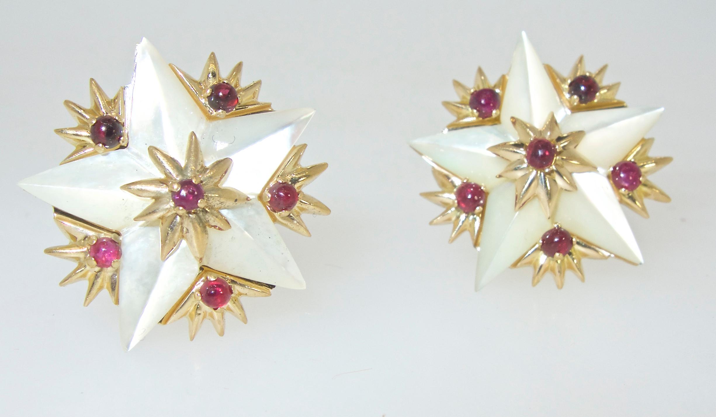 Jean Schlumberger for Tiffany & Co iconic star motif earrings in mother of pearl and with 12 natural bright red rubies.  These 18K earrings with French hallmarks and signed on the verso Schlumberger for Tiffany are .75 inches in diameter.  In fine