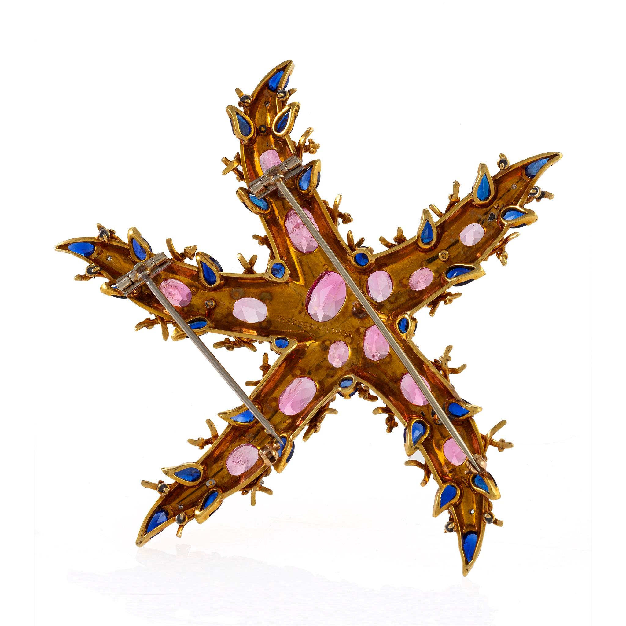 This dramatically oversized gemmy starfish brooch set with pink tourmalines, sapphires, and diamonds, mounted in gold and platinum, was designed by Jean Schlumberger and dates from the mid 1940s, when Schlumberger, just arrived to New York from