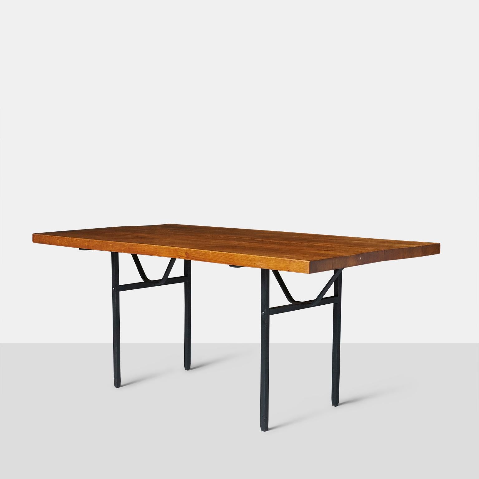 Jean Touret Dining Table
A rectangular dining table by Jean Touret with a 1 3/4