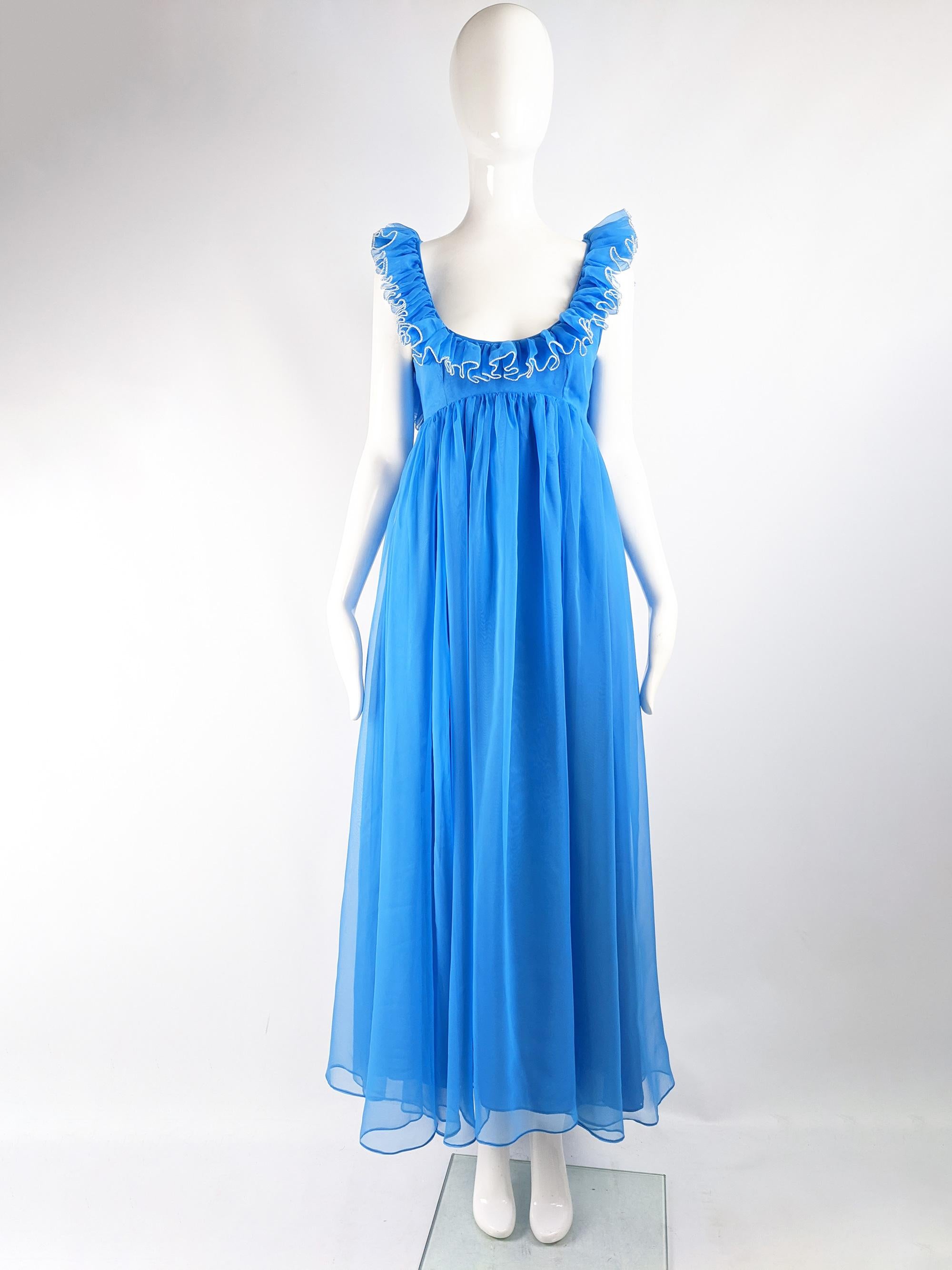 A beautiful vintage full length Jean Varon evening gown from the 60s, in a floaty blue chiffon with white edging and a fabulous ruffled collar and deep open back.

Size: Unlabelled; fits like a UK 10/ US 6/ EU 38. Please check measurements. 
Bust -