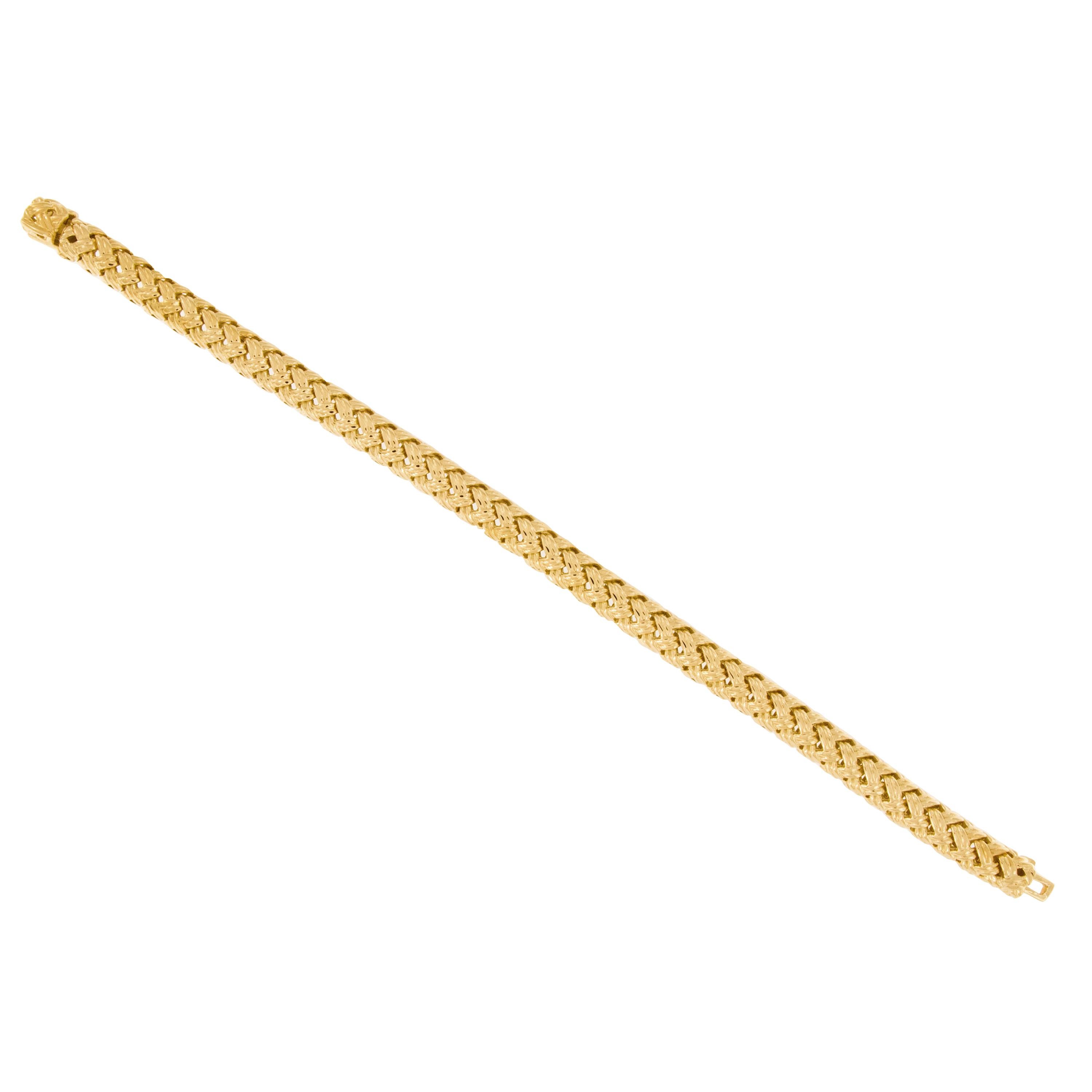 From the Vannerie Collection by Jean Vitau for Gemlok, this gorgeous 18 karat yellow gold interwoven & flexible bracelet is as comfortable on as it is beautiful! Jean Vitau founded Gemlok in New York city & quickly became famous for his unique way