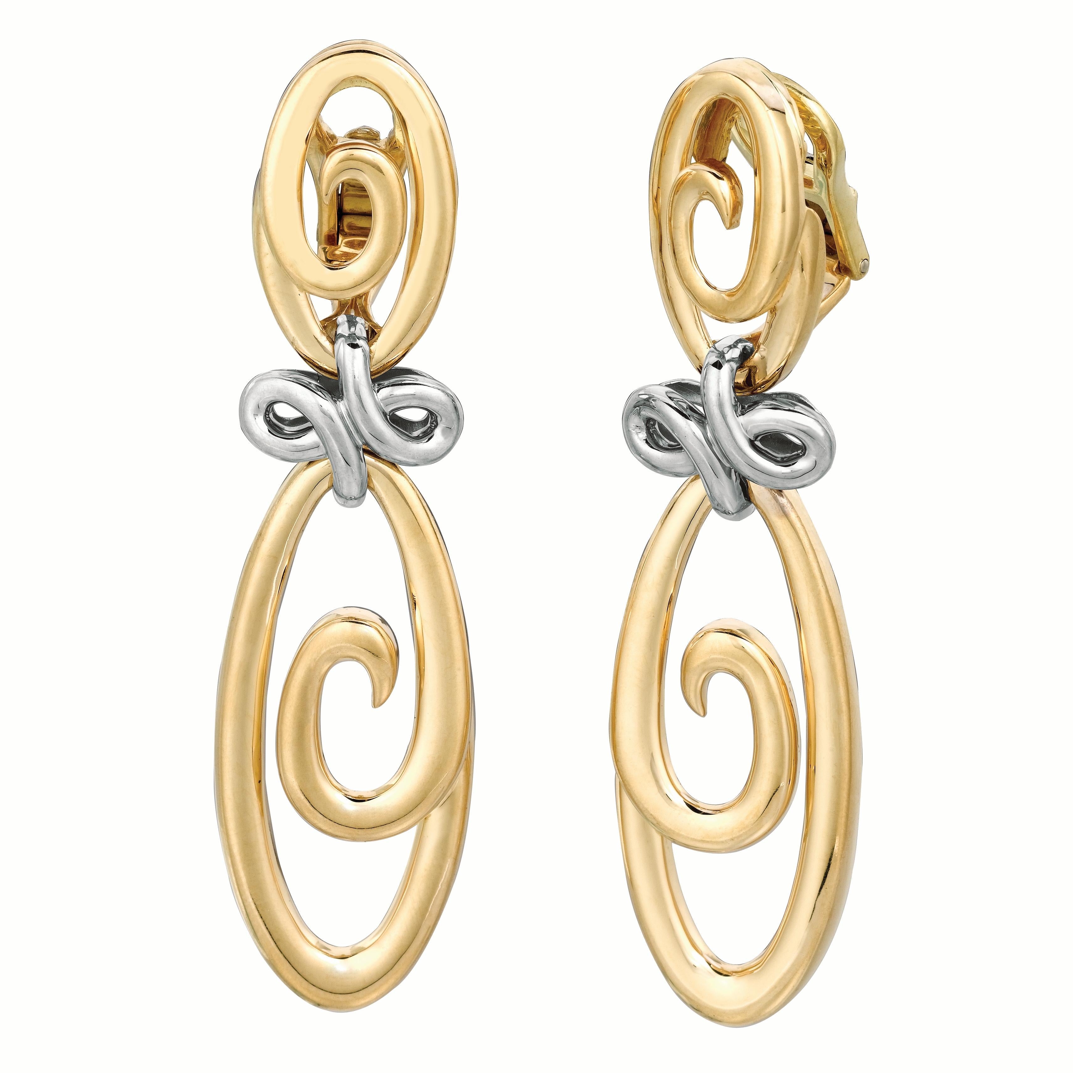 These 18K yellow and white gold uniquely designed motif earrings are a perfect everyday signature piece.  Named for it's harmonious, organic design, these drop earrings are unique and a jewelry wardrobe staple.