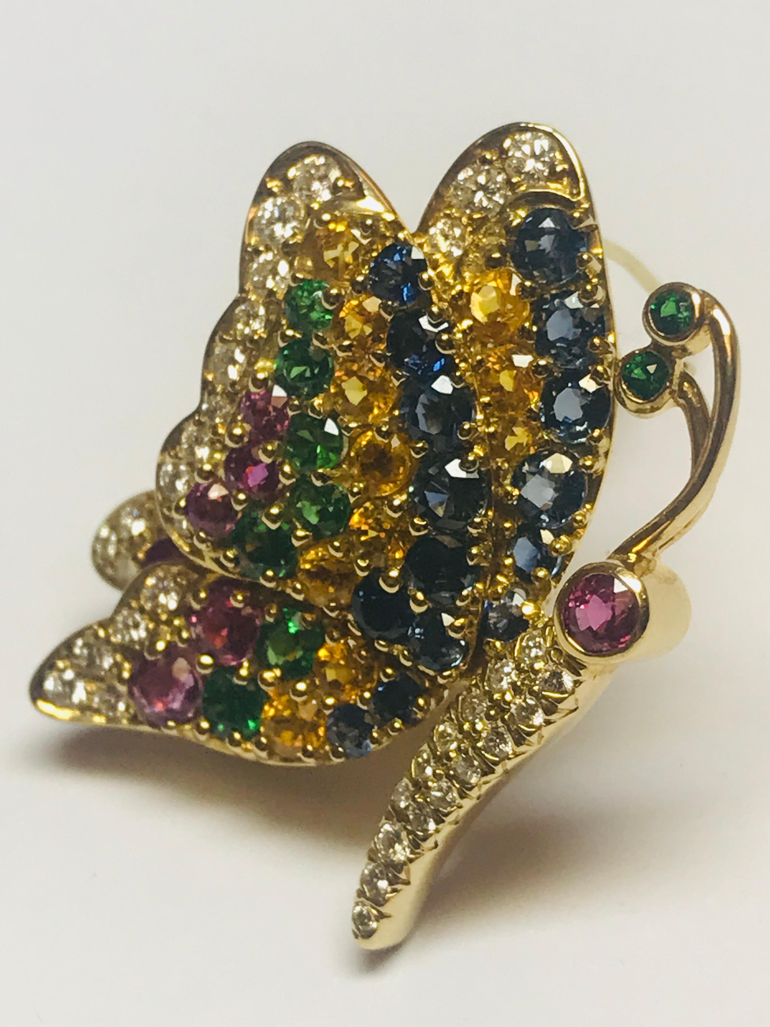 The combination of these 5 stones is perfectly designed, and created, by Jean Vitau to enhance the beauty of this profile butterfly pin. The multi colored piece has .67 carats of Diamonds, 1.80 carats of Blue Sapphires, 1.10 carats of Yellow