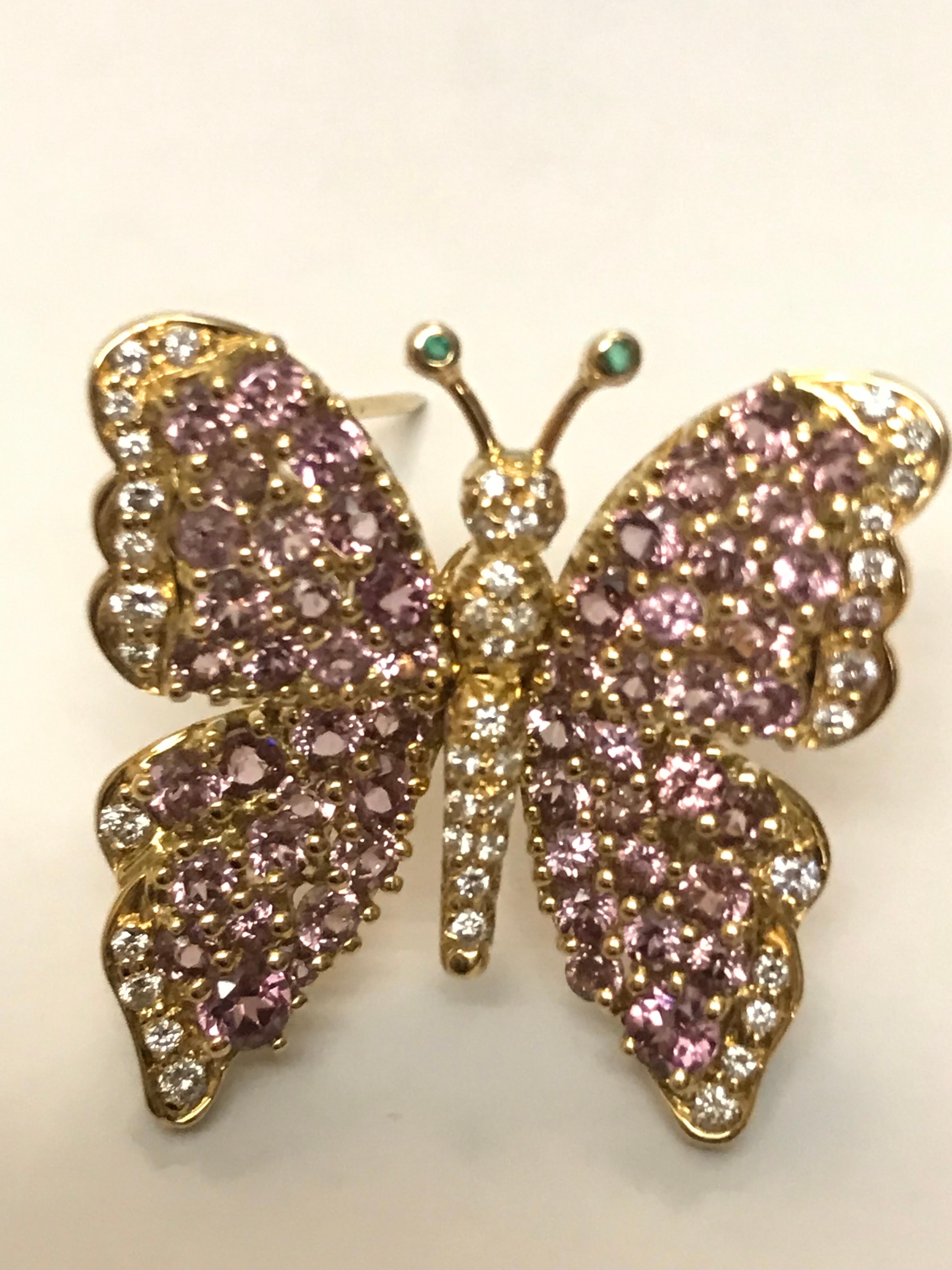 The color of these very unique Garnets makes this piece very special. Accented with F/G color white diamonds, it truly looks like she's flying. There are 4.50 carats of the gem Garnets and .43 carats of diamonds. This piece can also be converted to